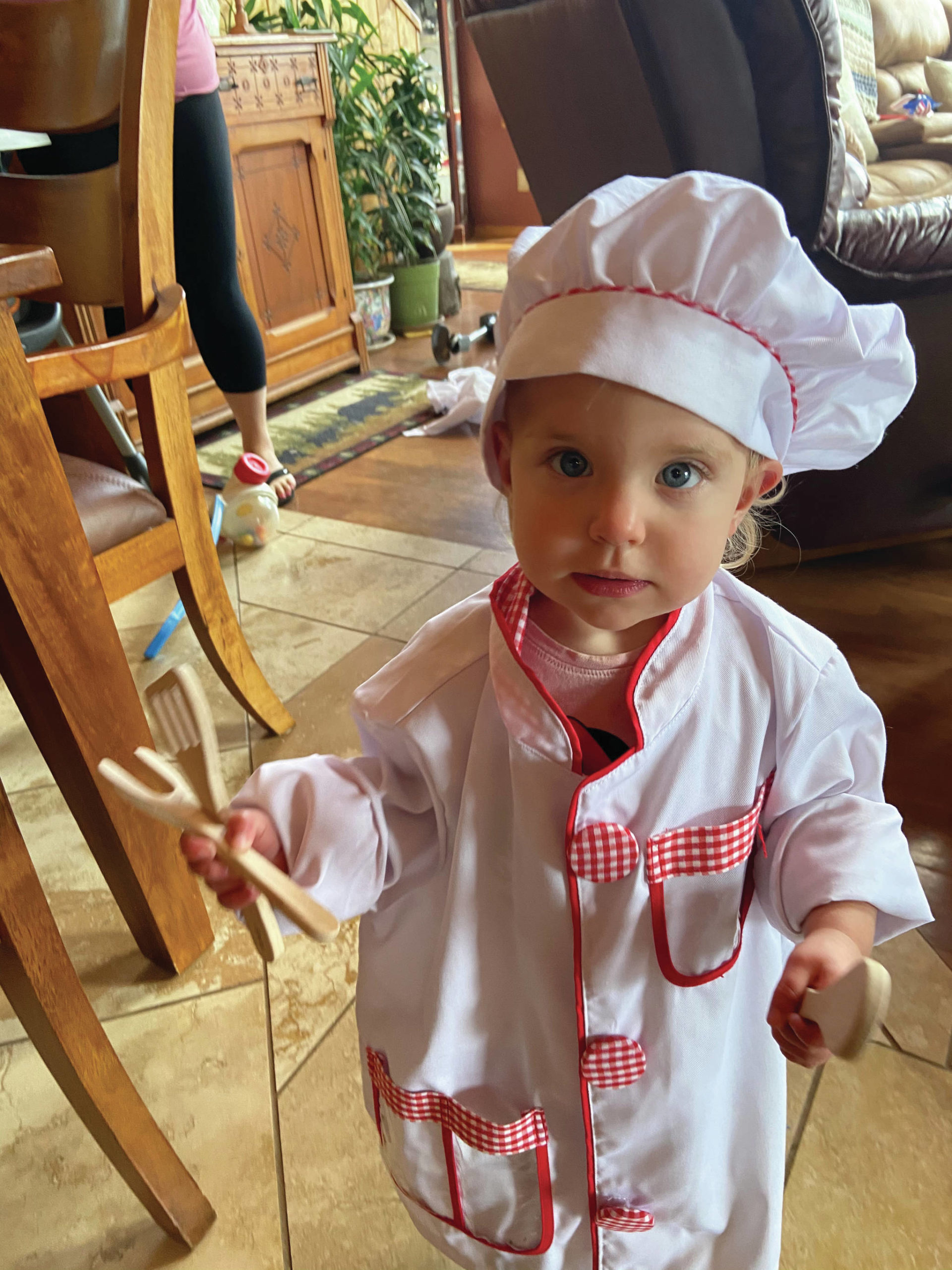 Teri Robl’s grandchild Ryan stands ready to assist on Saturday, July 11, 2020, in Robl’s Homer, Alaska, kitchen. (Photo by Teri Robl)