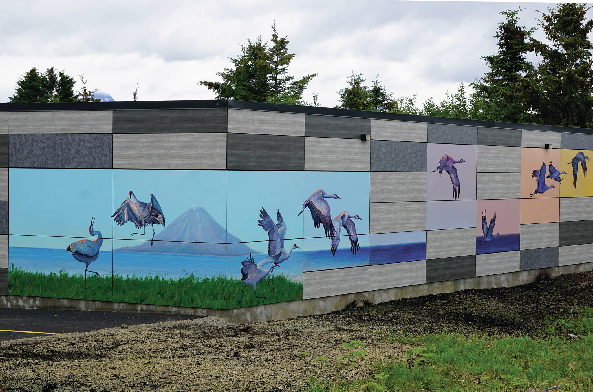 A mural by David Pettibone and Austin Parkhill is part of the 1% for art work on the new Homer Police Station, as seen here on June 25, 2020, in Homer, Alaska. (Photo by Michael Armstrong/Homer News)