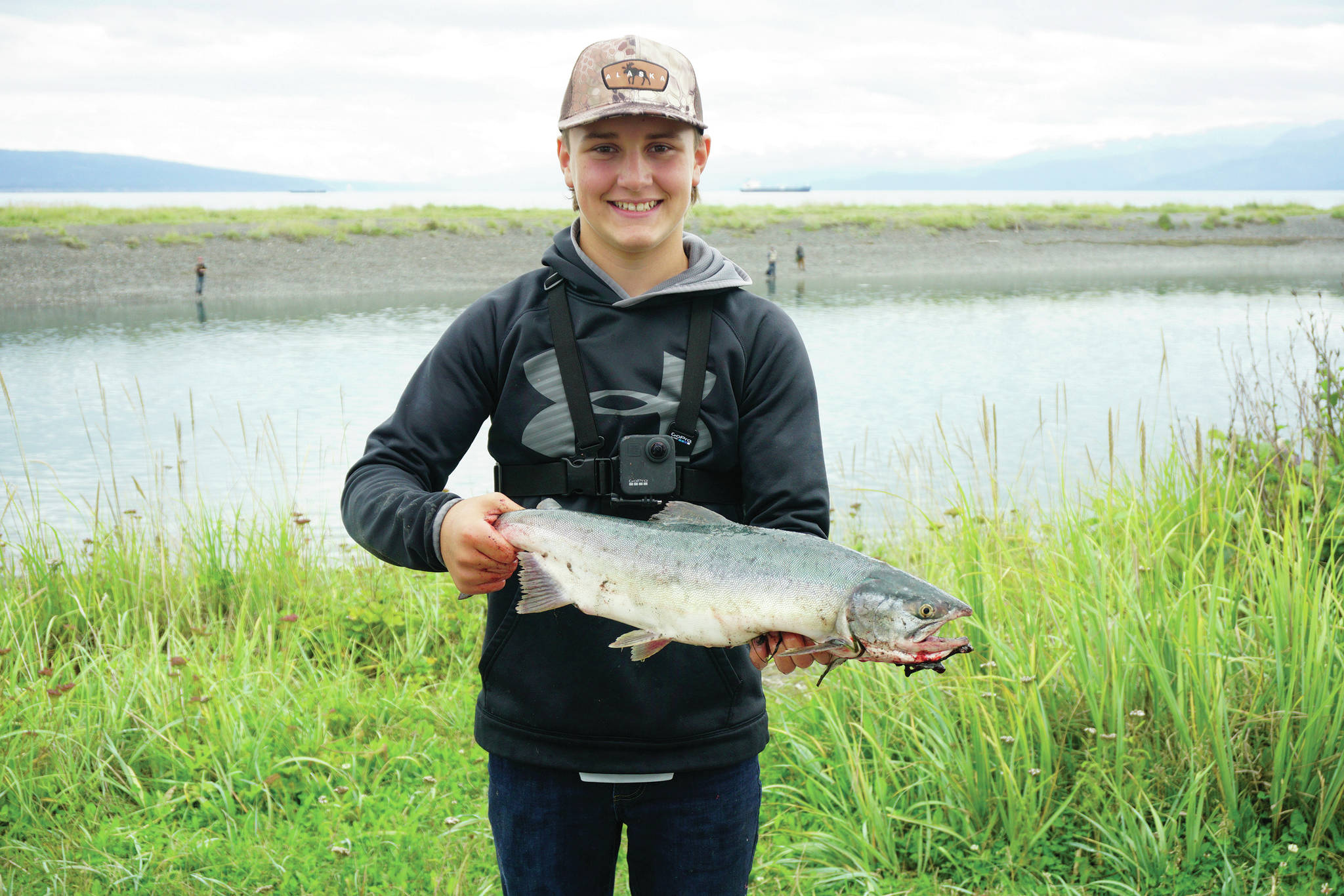 Reece Tousignant, 15, of Green Bay, Wisconsin, poses with a pink salmon he caught on Monday, Aug. 3, 2020, at the Nick Dudiak Fishing Lagoon in Homer, Alsaka. (Photo by Michael Armstrong/Homer News)