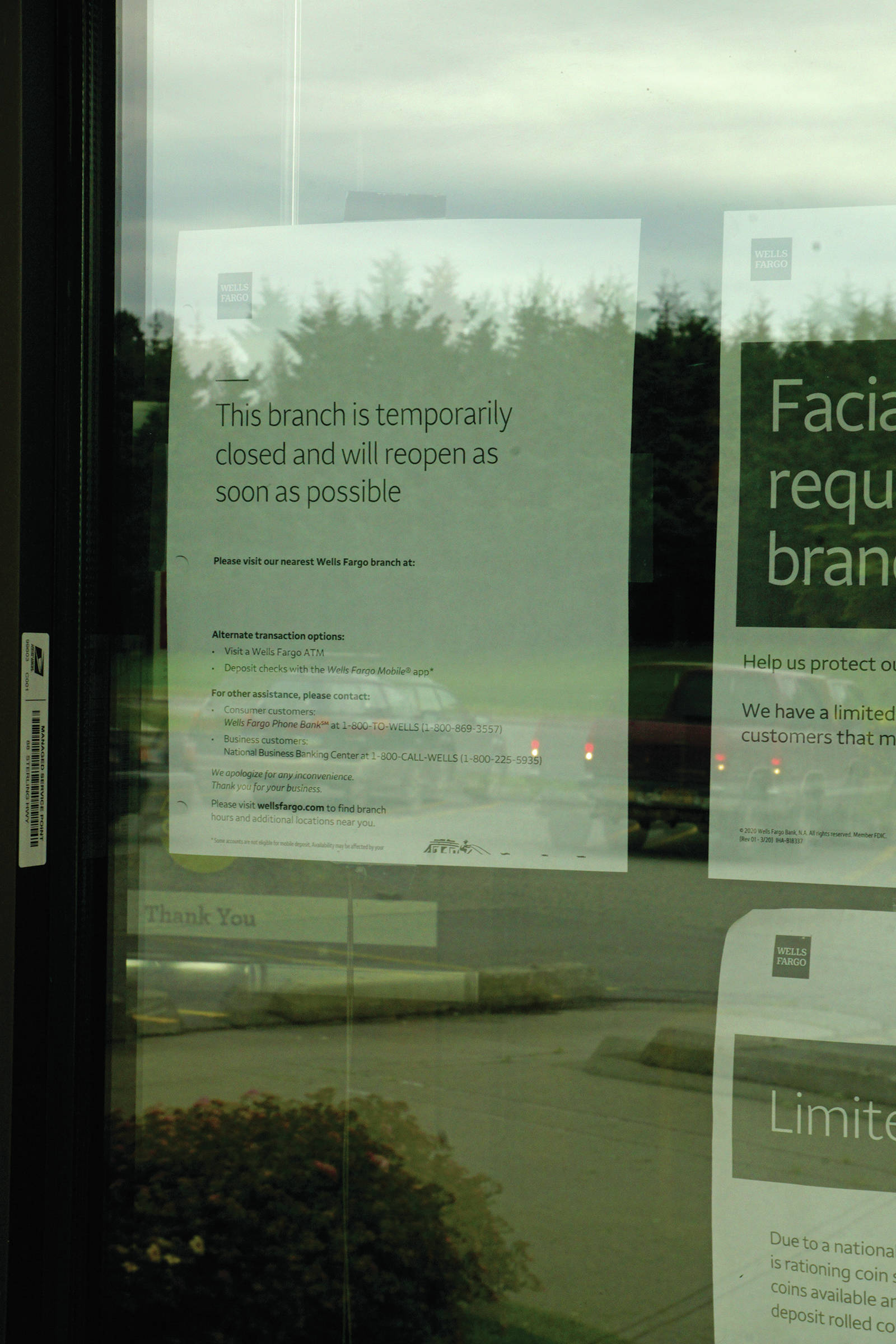 A sign on the door on Monday, Aug. 3, 2020, informs customers of a closure of the Homer branch of Wells Fargo in Homer, Alaska. (Photo by Michael Armstrong/Homer News)