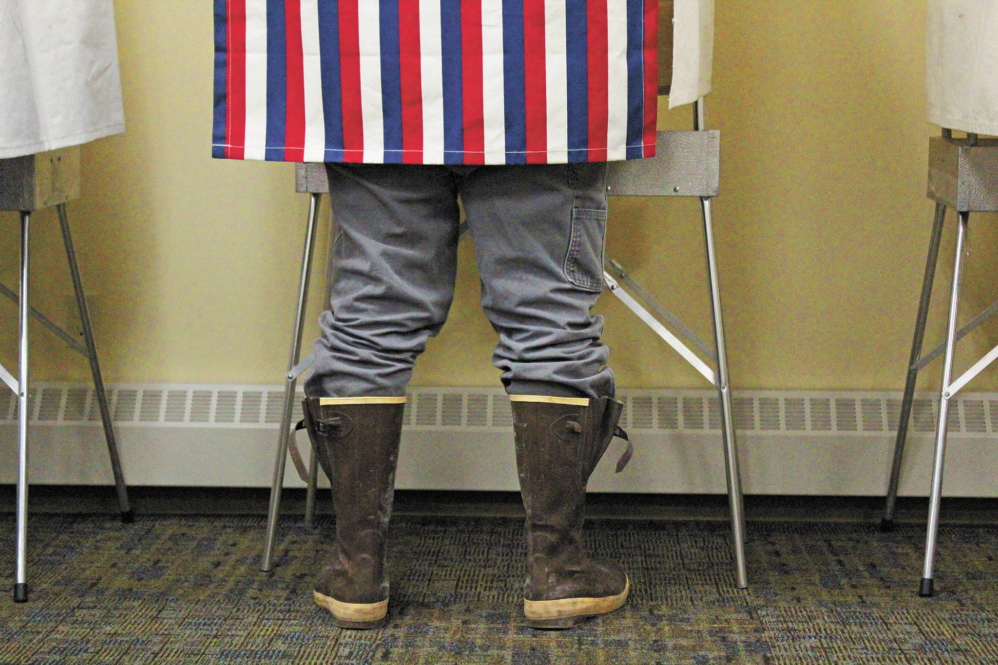 A Homer resident casts their vote during the Primary Election on Tuesday, Aug. 18, 2020 at Homer City Hall in Homer, Alaska. (Photo by Megan Pacer/Homer News)
