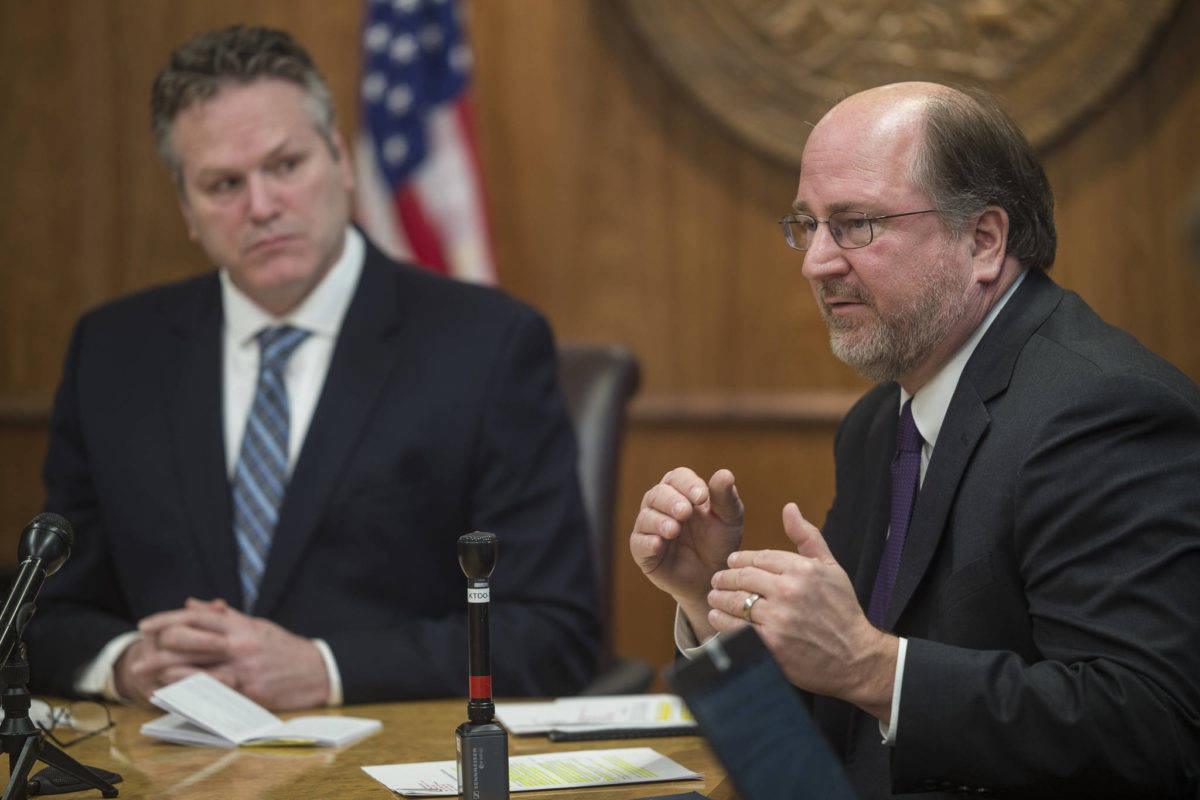 Michael Penn / Juneau Empire File                                Gov. Mike Dunleavy, left, listens as Attorney General Kevin Clarkson speak during a news conference at the Capitol on Wednesday, Jan. 30, 2019. Clarkson’s resignation was announced following revelations of inappropriate text messages with a state employee.