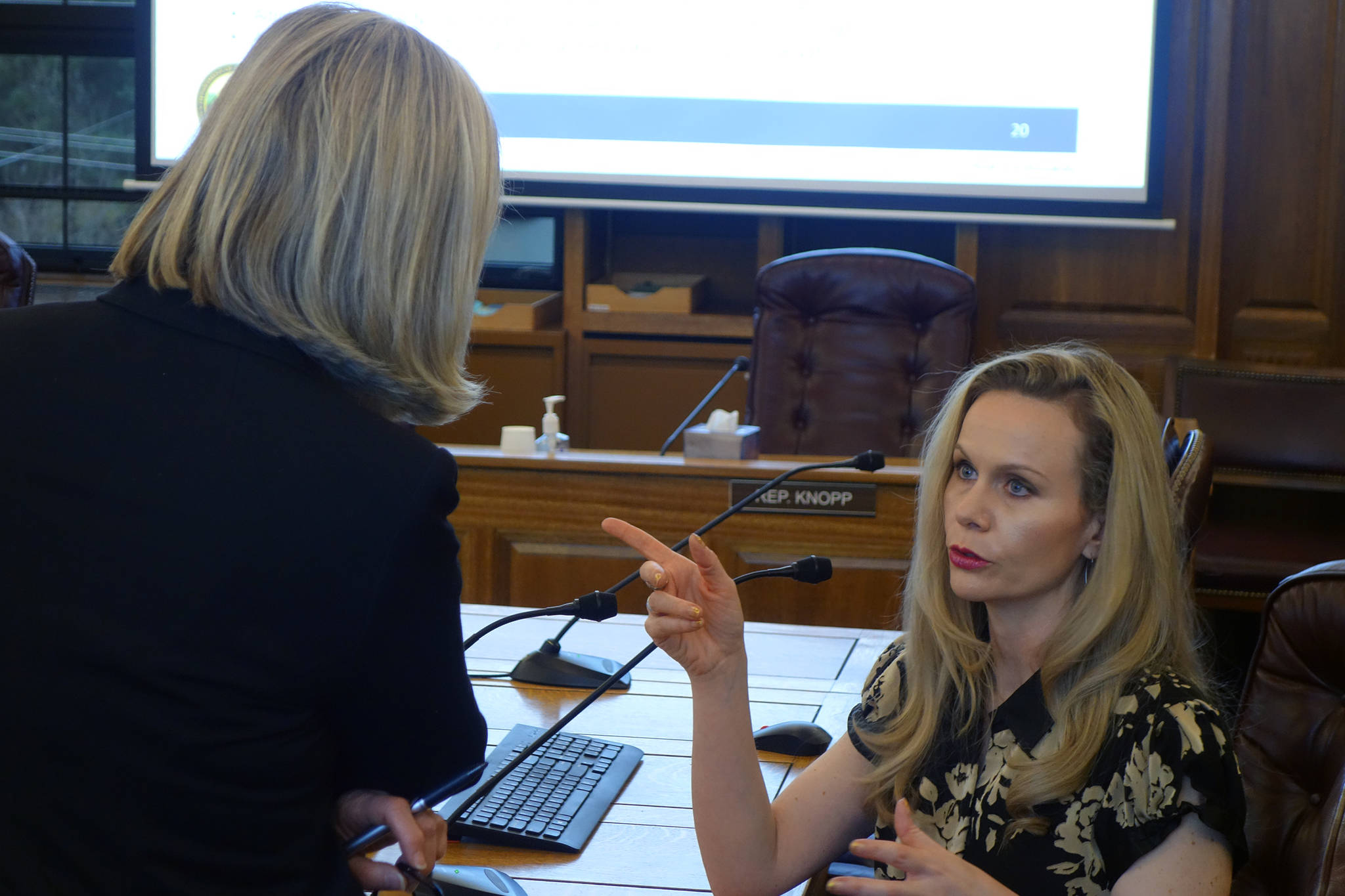 Ben Hohenstatt / Juneau Empire File                                 Rep. Andi Story, D-Juneau, talks with Department of Administration Commissioner Kelly Tshibaka following a House Administration Committee Finance Subcommittee meeting in this January 2020 photo.