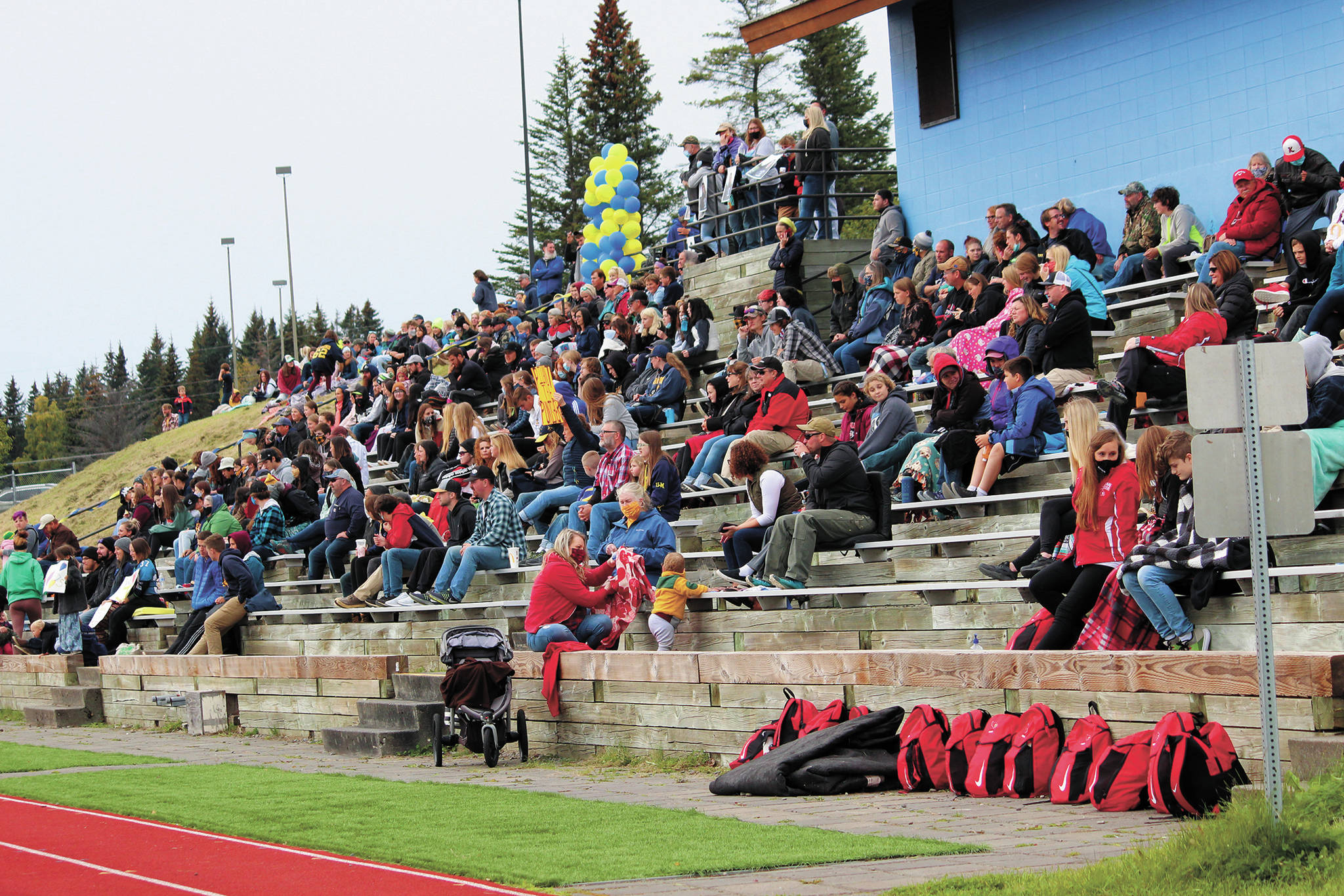 A crowd of Mariner and Kardinals fans watch a Saturday, Sept. 19, 2020 football game against Kenai Central High School at Homer High School in Homer, Alaska. (Photo by Megan Pacer/Homer News)