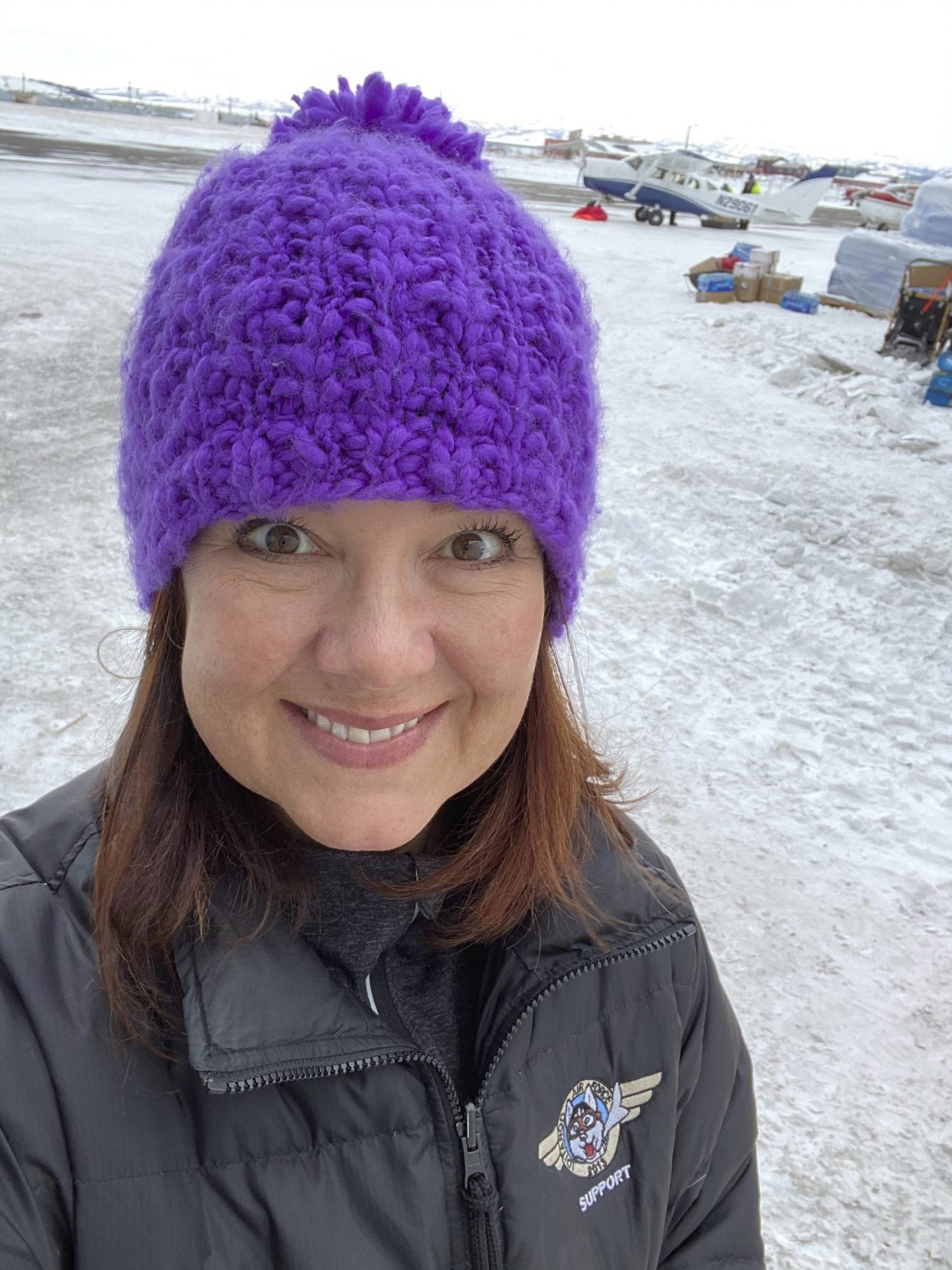 This March 13, 2020, photo, provided by Dr. Jodie Guest, an infectious disease epidemiologist at Emory University in Atlanta, shows Guest as an Iditarod Trail Sled Dog Race volunteer at a checkpoint in Unalakleet, Alaska. Guest will help advise the Iditarod as it plans to run the 2021 race amid the coronavirus pandemic. (Courtesy Photo / Dr. Jodie Guest)