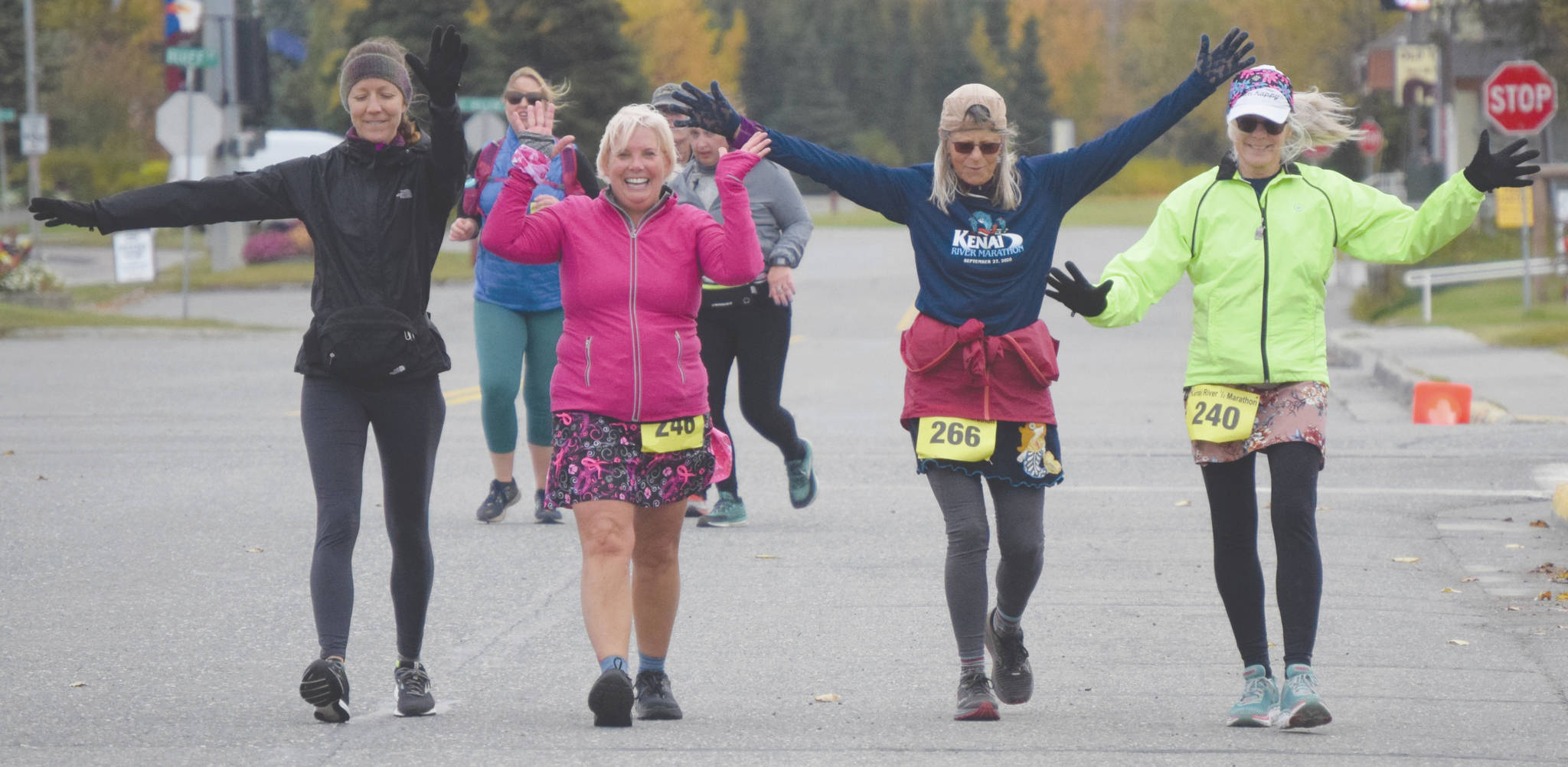 Ninilchik’s Elise Spofford supports Anchorage’s Julie Jokinen, Anchorage’s Sara Peebles and Soldotna’s Debra Hart in the half marathon at the Kenai River Marathon in Kenai, Alaska, on Saturday, Sept. 27, 2020. (Photo by Jeff Helminiak/Peninsula Clarion)
