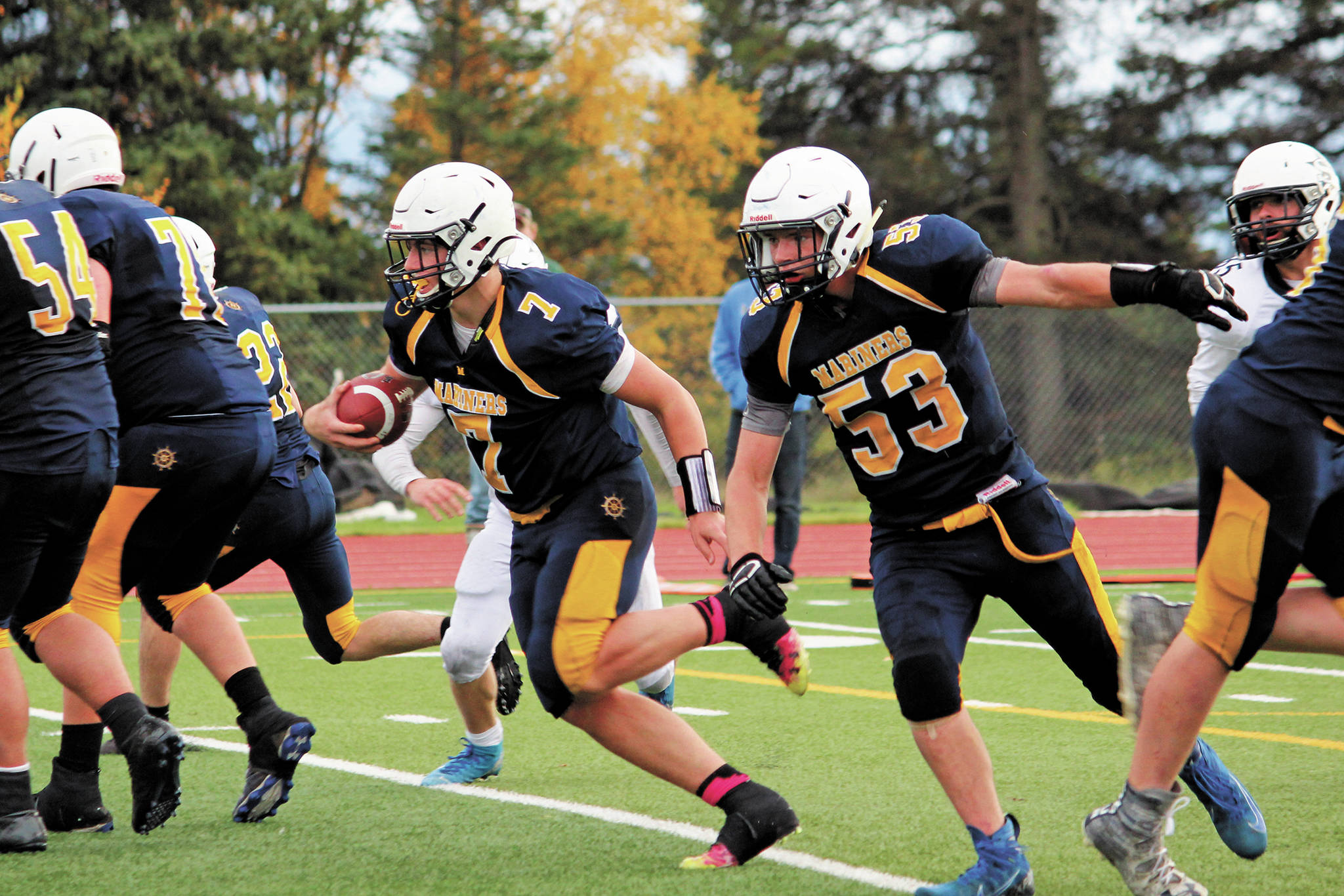 Homer quarterback Carter Tennison keeps the ball during a play in a Saturday, Oct. 3, 2020 football game against Soldotna High School at Homer High School in Homer, Alaska. (Photo by Megan Pacer/Homer News)