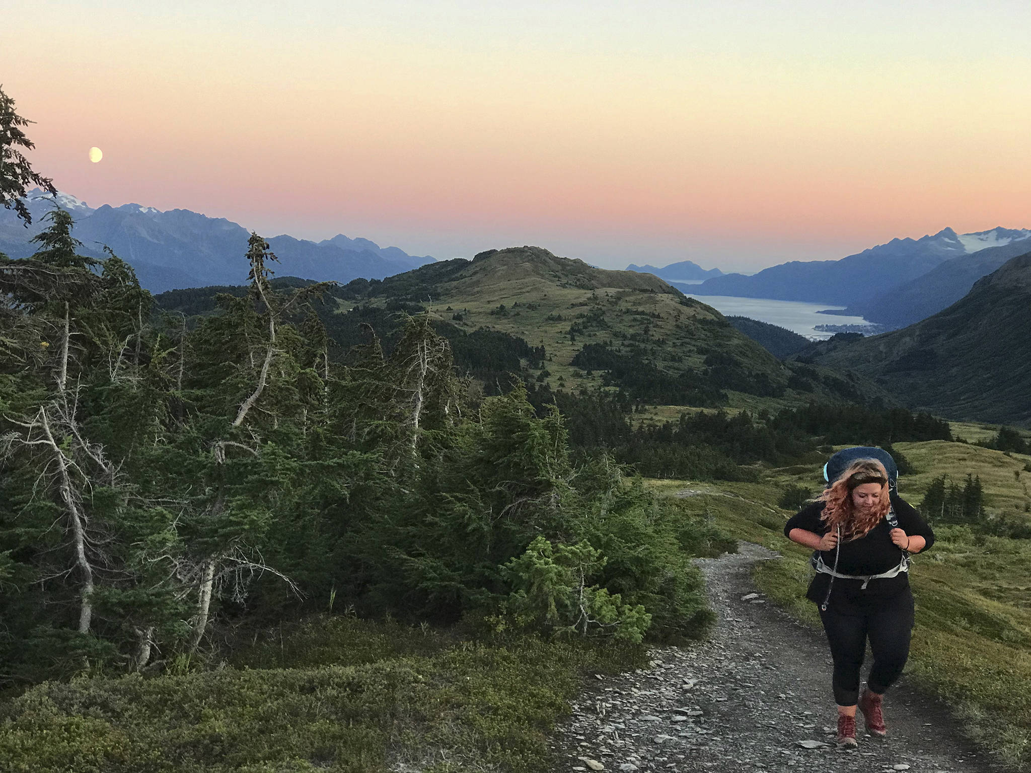 The author hikes up a ridge on the way to Lost Lake on Aug. 28, 2020 near Seward, Alaska. (Photo by Lauren Jerew)