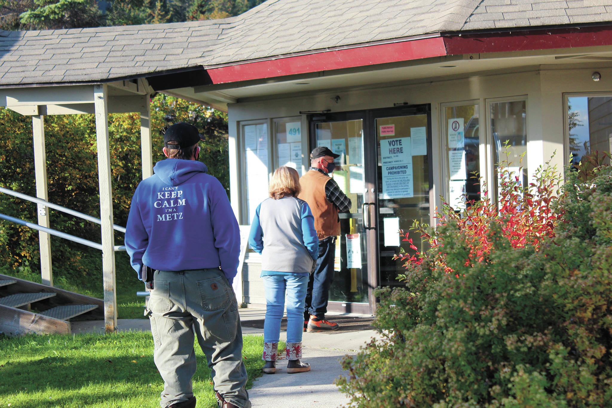 A short line forms outside of Homer City Hall as people wait to vote in the regular municipal election on Tuesday, Oct. 6, 2020 in Homer, Alaska. (Photo by Megan Pacer/Homer News)