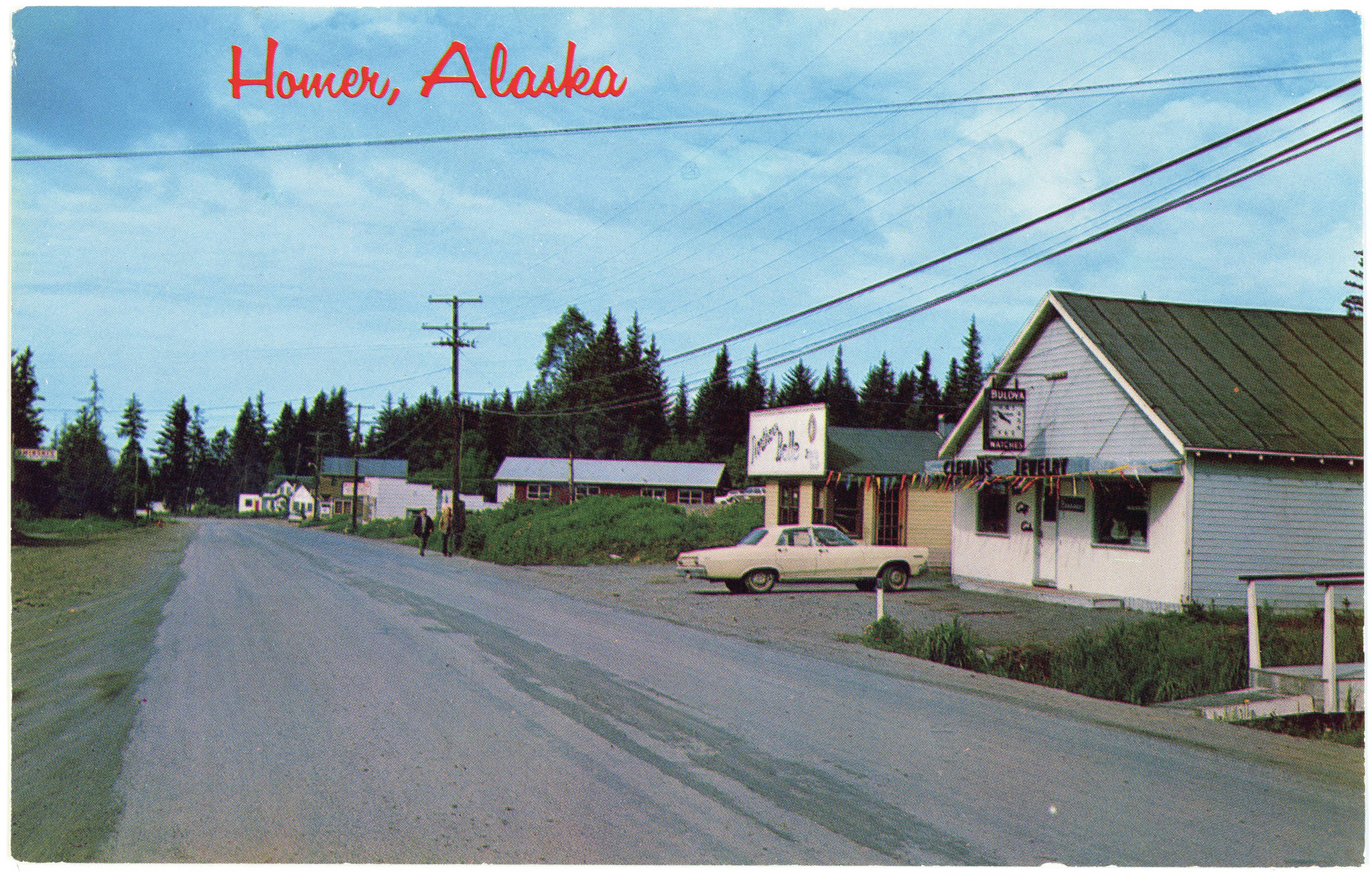 An undated postcard shows Pioneer Avenue looking west in Homer, Alaska, before it was paved. The building on the right is the former Homer Women’s Club which later became the Homer News and then Cafe Cups. The remodeled building is now Little Mermaid Restaurant. The postcard is included in the museum’s “Greetings from the Past: History in Postcards” exhibit that opened Thursday, Oct. 22, 2020, in Homer, Alaska. (Photo courtesy Pratt Museum from its collection)