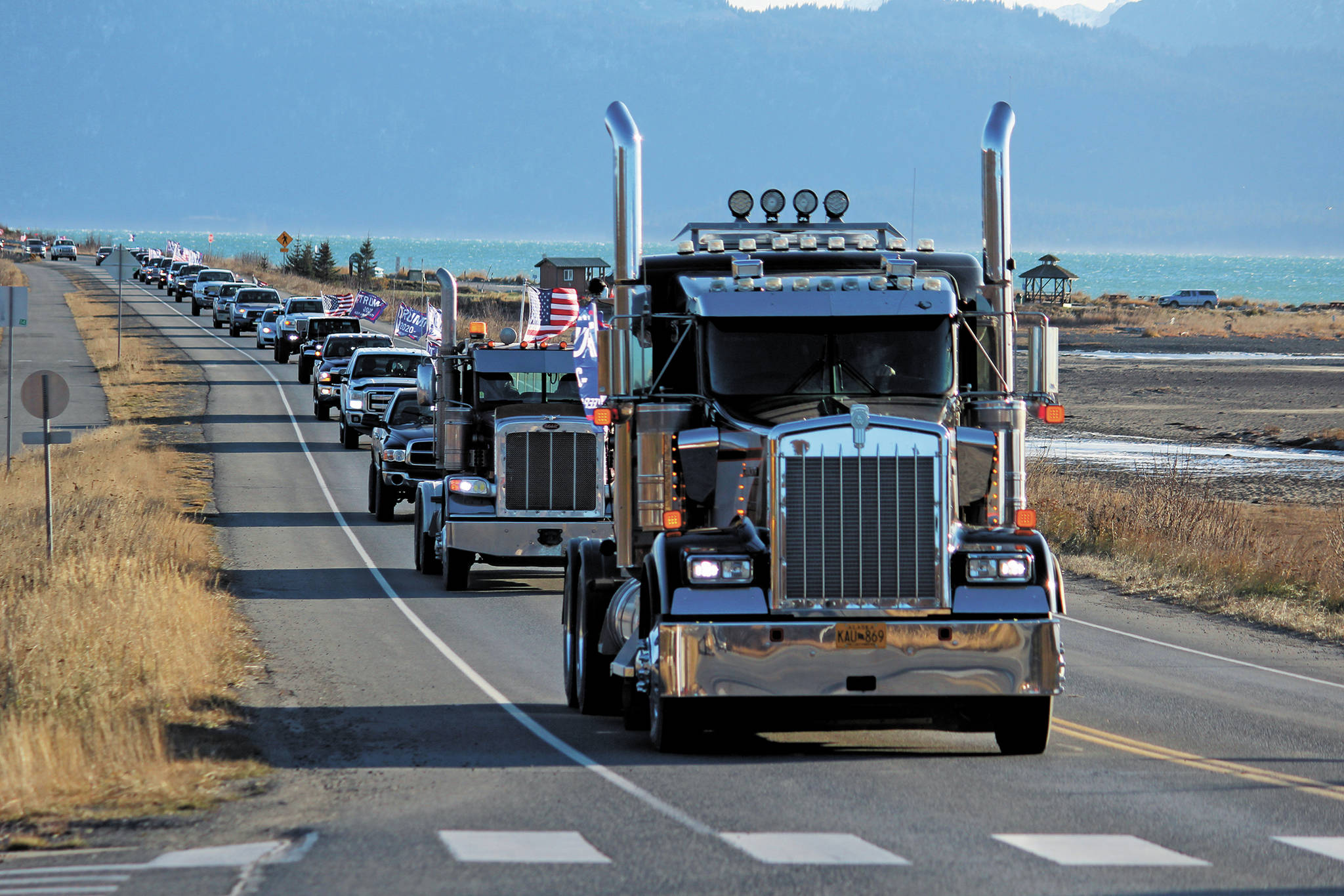 Participants in a vehicle parade to support President Donald Trump make their way off the Homer Spit on Sunday, Nov. 1, 2020 in Homer, Alaska. Organized by a Homer resident, the event was not part of similar parades that took place across the state and country over the weekend. (Photo by Megan Pacer/Homer News)
