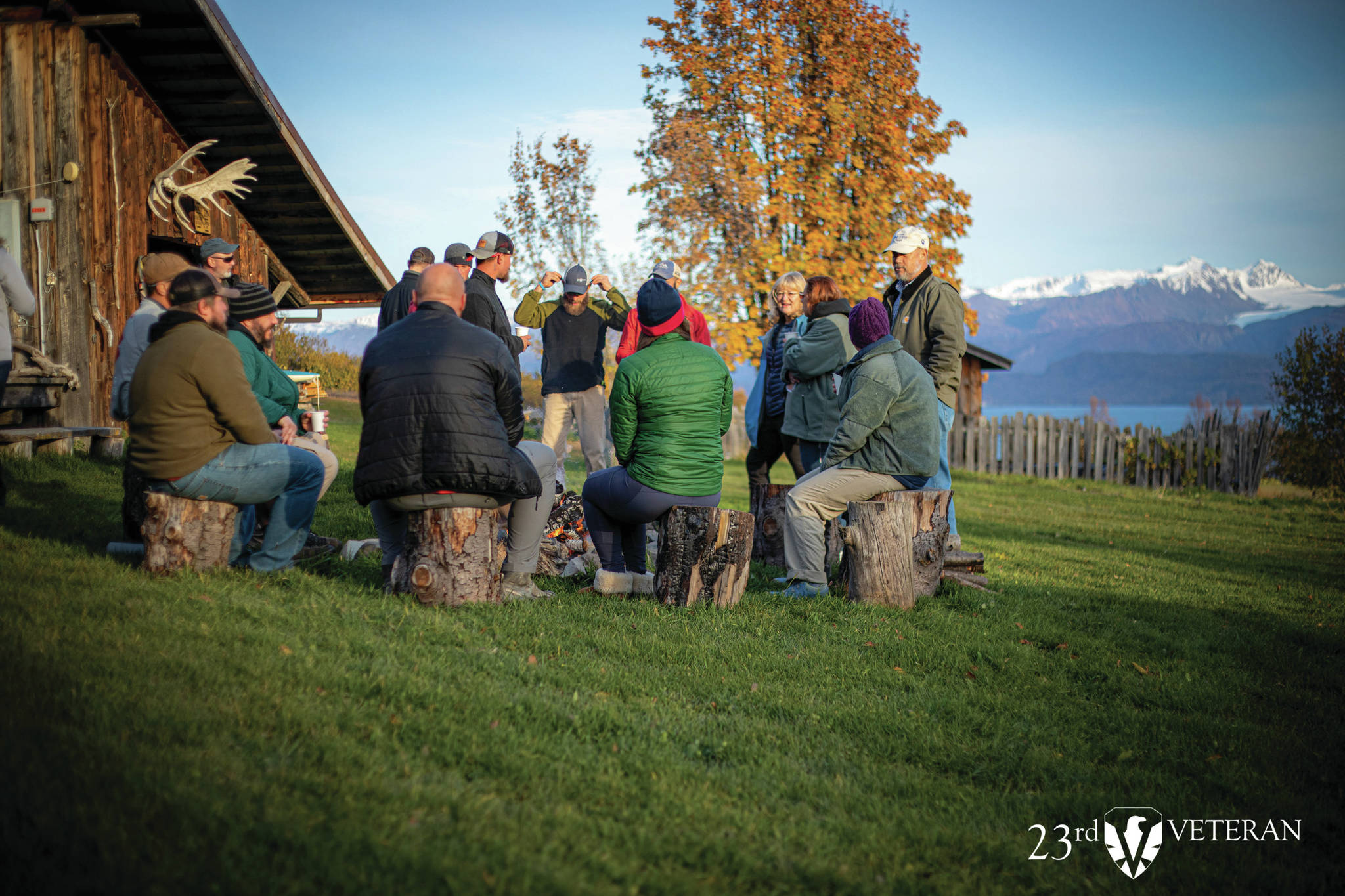 A group of veterans who participated in the 23rd Veteran trip to Homer, Alaska, sit around a campfire at the Kilcher Family Homestead on the last day of the trip on Friday, Oct. 16, 2020, near Homer, Alaska. (Photo courtesy of 23rd Veteran)