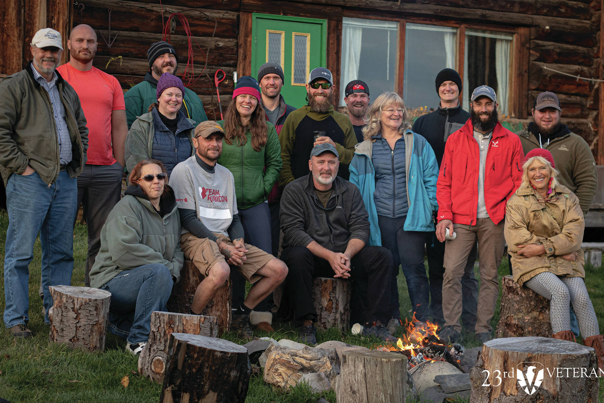 A group of veterans who participated in the 23rd Veteran trip to Homer, Alaska, pose at the Kilcher Family Homestead near Homer, Alaska, on the last day of the trip on Friday, Oct. 16, 2020. At far right, front, is Stellavera Kilcher, and third from right is Catkin Kilcher Burton, two of the Kilcher family members who participated in the visit. (Photo courtesy of 23rd Veteran)