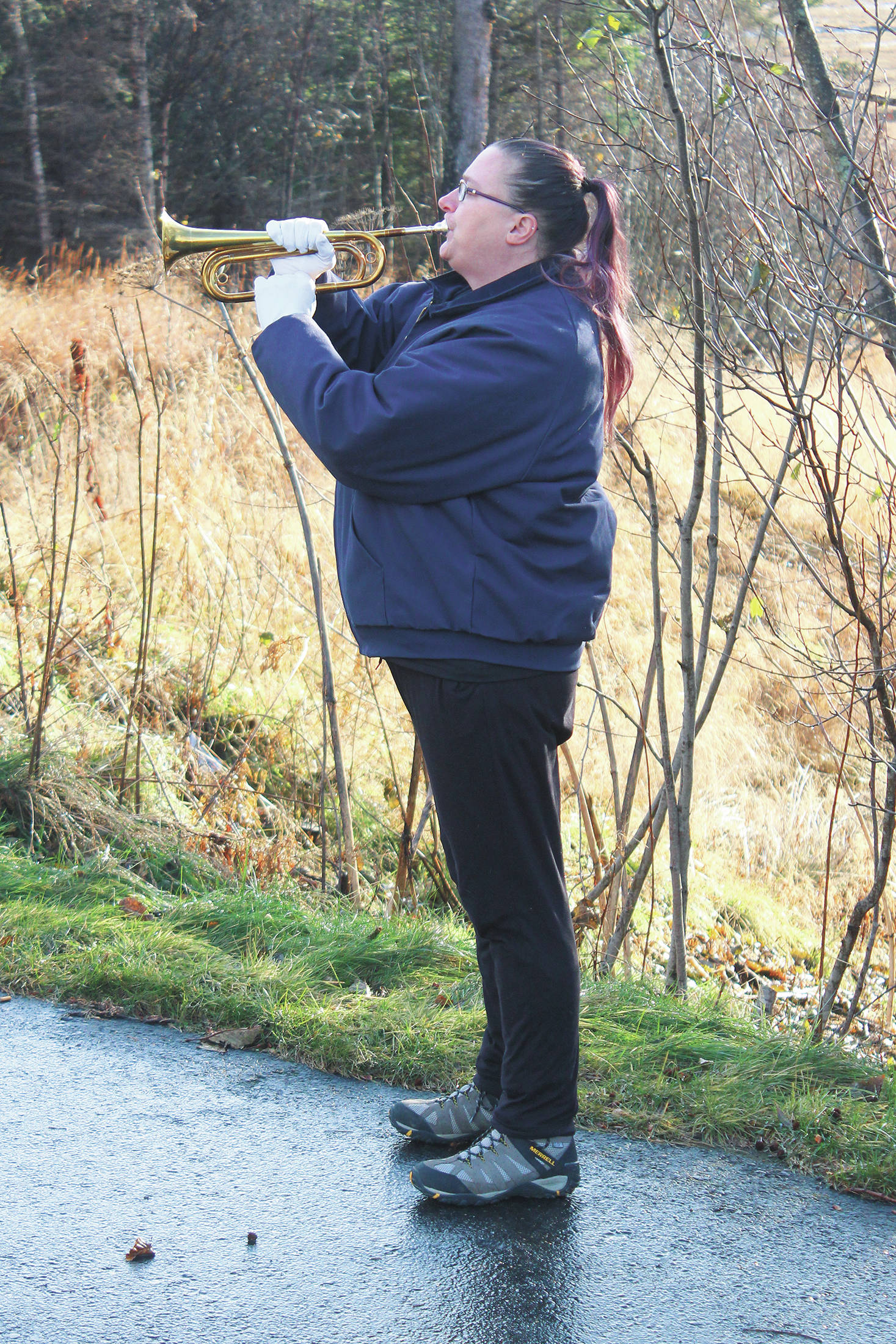 Christine Bond-Hill plays taps during this year’s Veterans Day celebration on Wednesday, Nov. 11, 2020 at the Alaska Islands & Ocean Visitor Center in Homer, Alaska. (Photo by Megan Pacer/Homer News)