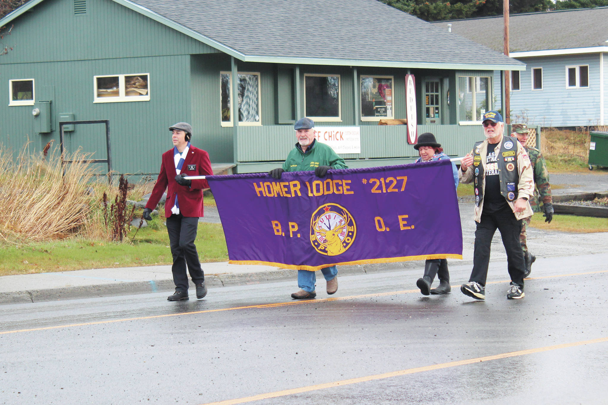 Members of the Homer Elks Lodge participate in this year’s Veterans Day parade and celebration, marching down Pioneer Avenue on Tuesday, Nov. 11, 2020 in Homer, Alaska. (Photo by Megan Pacer/Homer News)