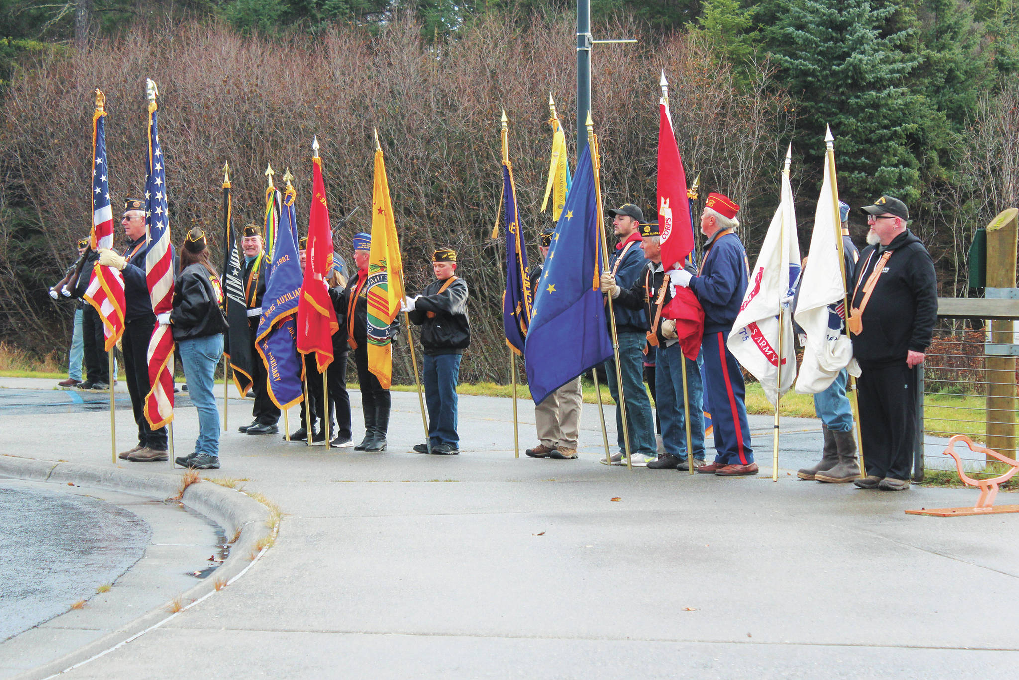 Participants in this year’s Veterans Day celebration assemble at the Alaska Islands & Ocean Visitor Center on Wednesday, Nov. 11, 2020 in Homer, Alaska. (Photo by Megan Pacer/Homer News)
