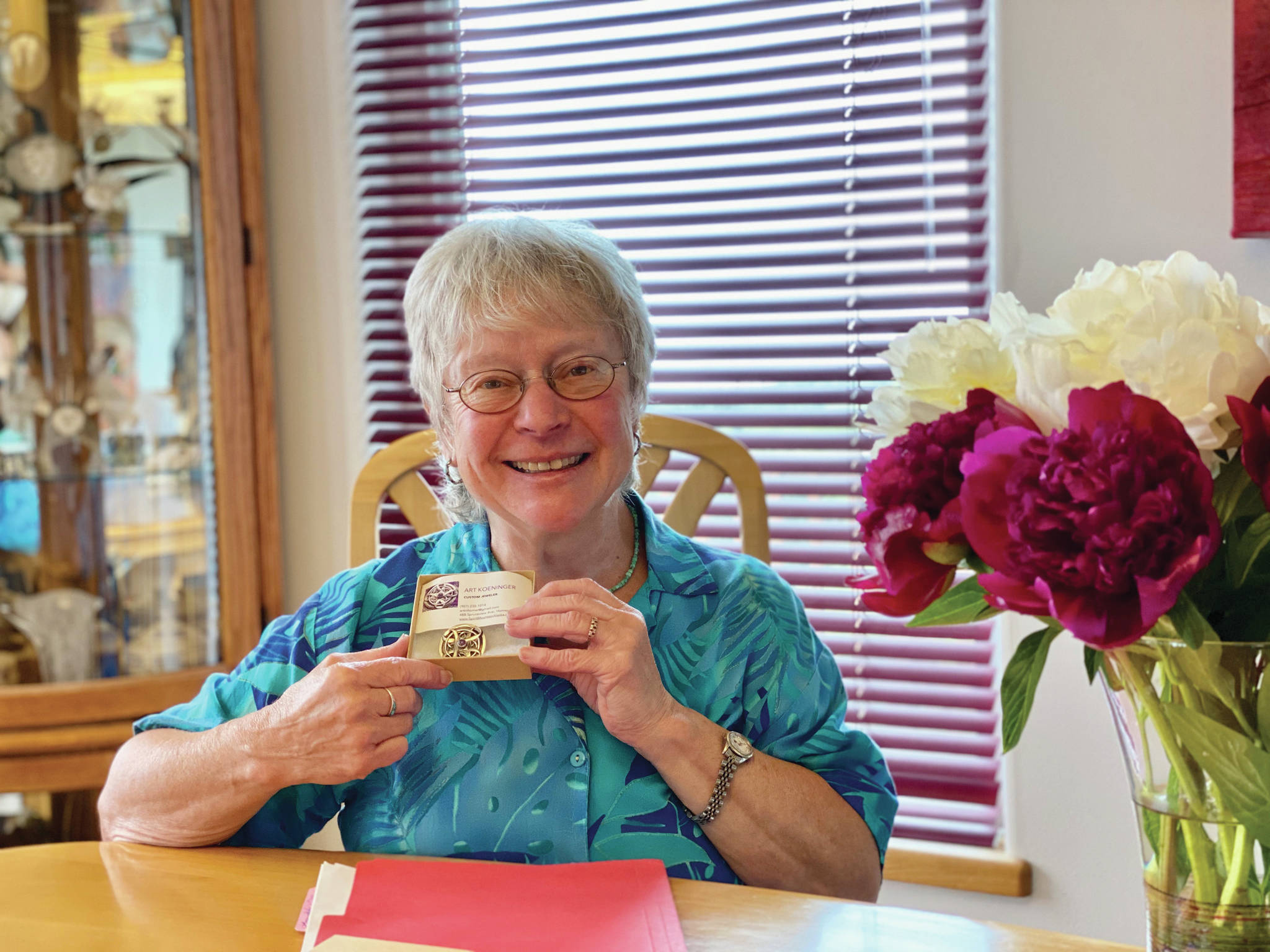 Woman of Wisdom Roberta Highland holds her award from South Peninsula Haven House in this photo taken July 25, 2020, in Homer, Alaska. (Photo courtesy South Peninsula Haven House)