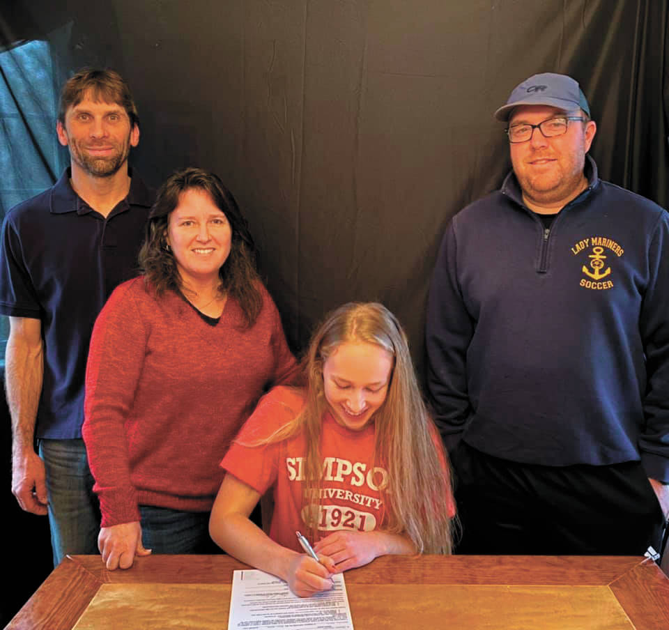 Jessica Sonnen signs her National Letter of Intent to play soccer at Simpson University. (Photo courtesy Karin Sonnen)