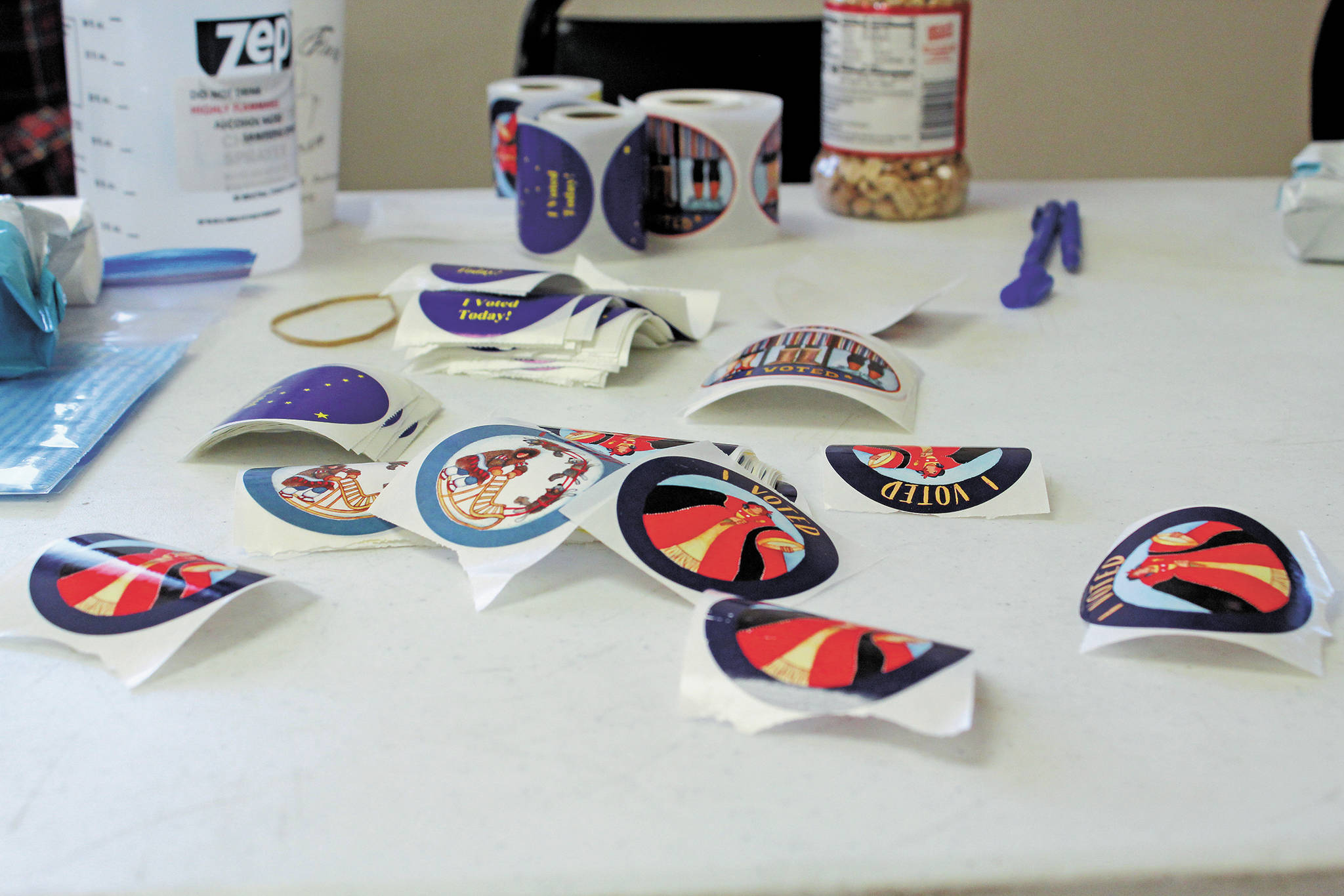 “I Voted” stickers wait on a table in the Kachemak Community Center for voters to pick them up Tuesday, Nov. 3, 2020 in Kachemak City, Alaska. (Photo by Megan Pacer/Homer News)