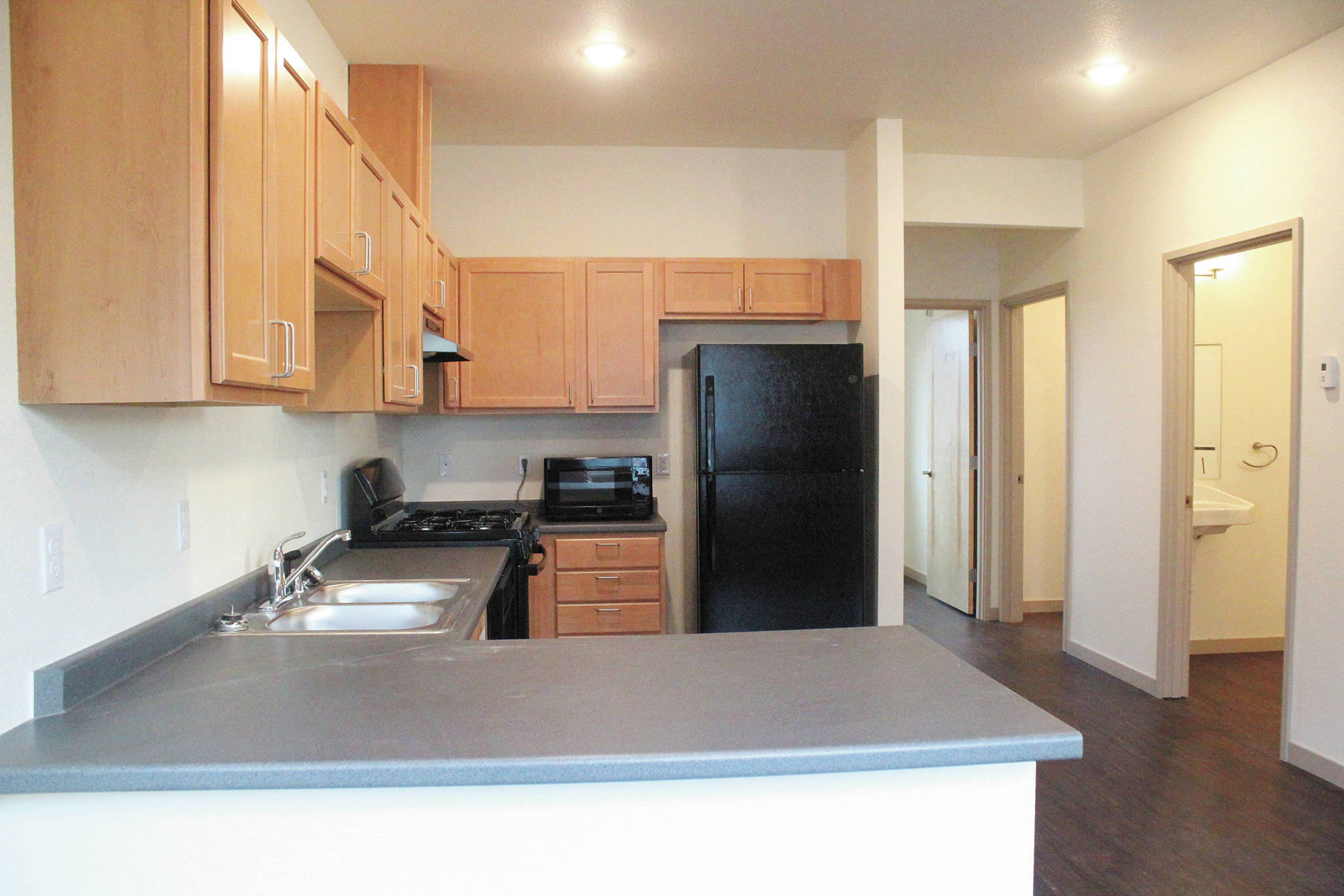 The kitchen area of a unit in the East End Cottages affordable housing complex, seen here on Nov. 12, 2020 in Kachemak City, Alaska. (Photo by Megan Pacer/Homer News)