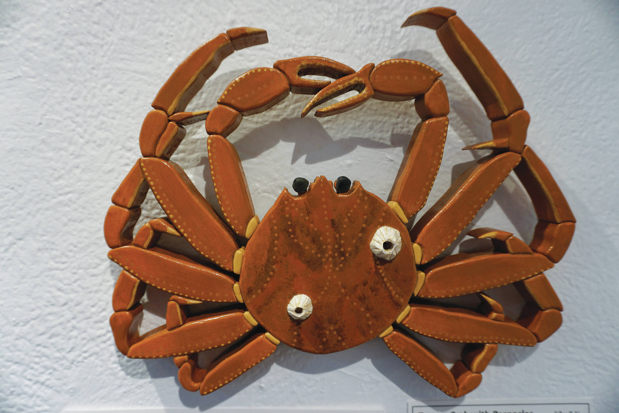 “Tanner Crab with Barnacles” is one of the wood sculptural pieces in Kim Schuster’s exhibit, “Science Observed Through Art: Unsung Species,” as seen here on Friday, Dec. 4, 2020, at Ptarmigan Arts in Homer, Alaska. (Photo by Michael Armstrong/Homer News)