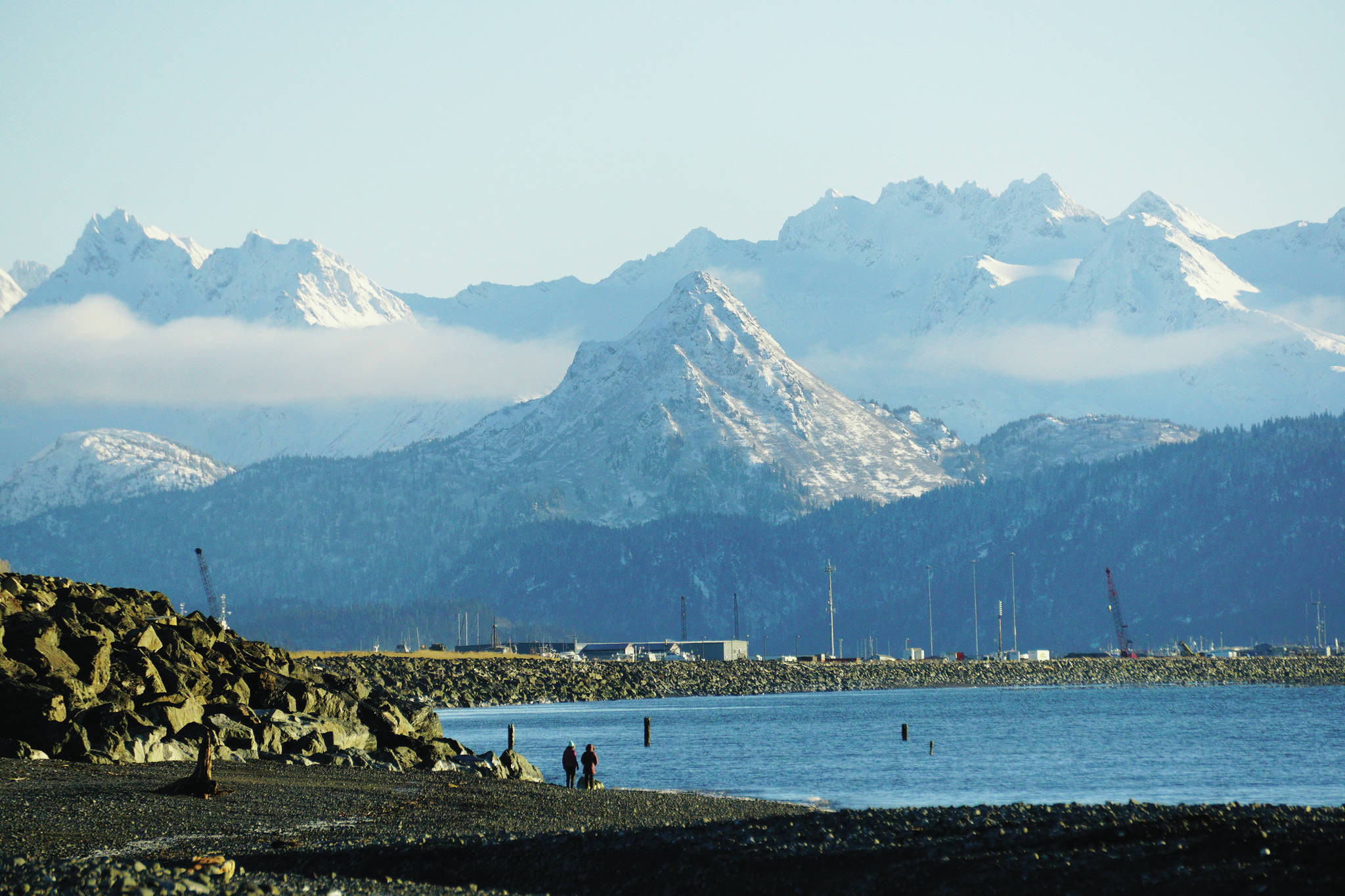 Although snow has fallen on Poot Peak, the image of the iconic bear’s eyes and nose of the mountain remains faint, as seen here on Friday, Dec. 4, 2020, in Homer, Alaska. The mountain is named after Henry Poot, also known as “China” Poot, an Alaska Native man who hunted and fished in the area in the early 1900s. According to Marilyn Sigman’s “Entangled: People and Ecological Change in Alaska’s Kachemak Bay,” Poot was the son of a Native woman and a Chinese cannery worker. (Photo by Michael Armstrong/Homer News)