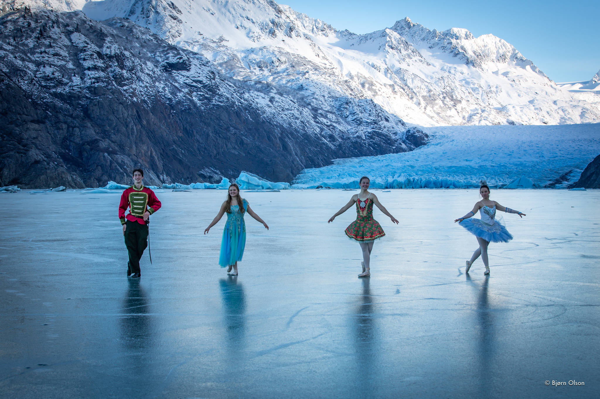“Petite Nutcracker Ballet” dancers Liam James, Aiyana Cline, Ireland Styvar and Kathy Brennan pose on Nov. 12, 2020, on the ice of Grewingk Glacier lake near Homer, Alaska. (Photo by Bjørn Olson)