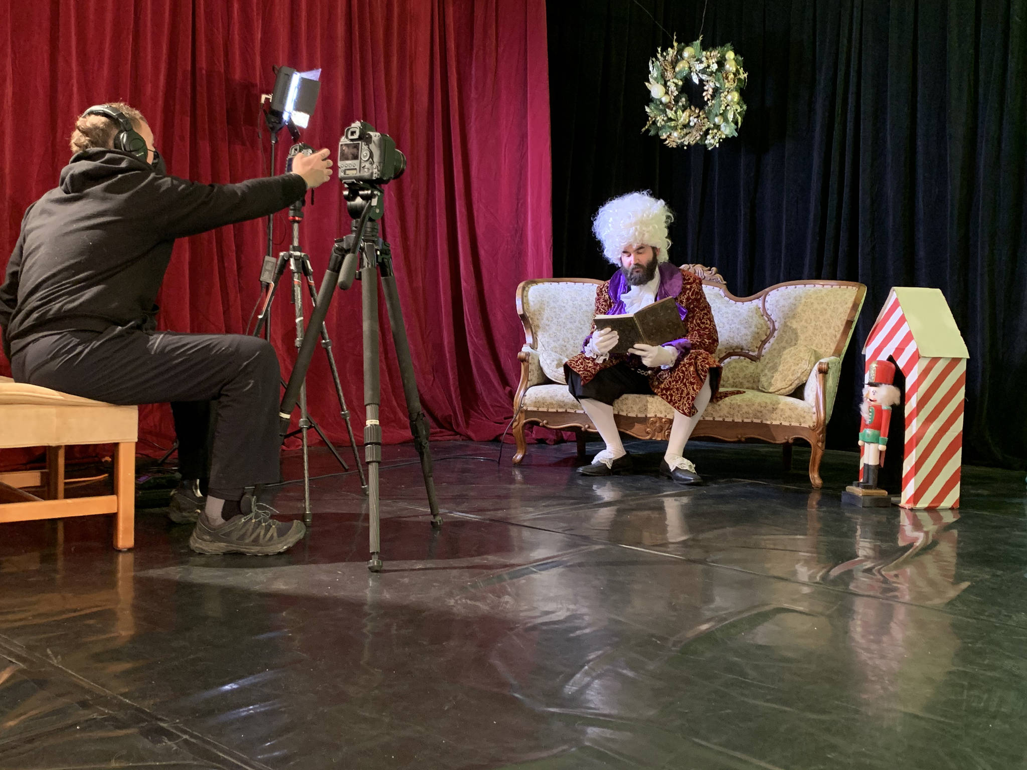 Bjørn Olson, left, films Aaron Walbrecher as Drosselmeyer, right, on Dec. 5, 2020, for a scene in the “Petite Nutcracker Ballet” at the Homer Nutcracker Productions’ black box theater in the Wildberry Building in Homer, Alaska. (Photo by Jennifer Norton)