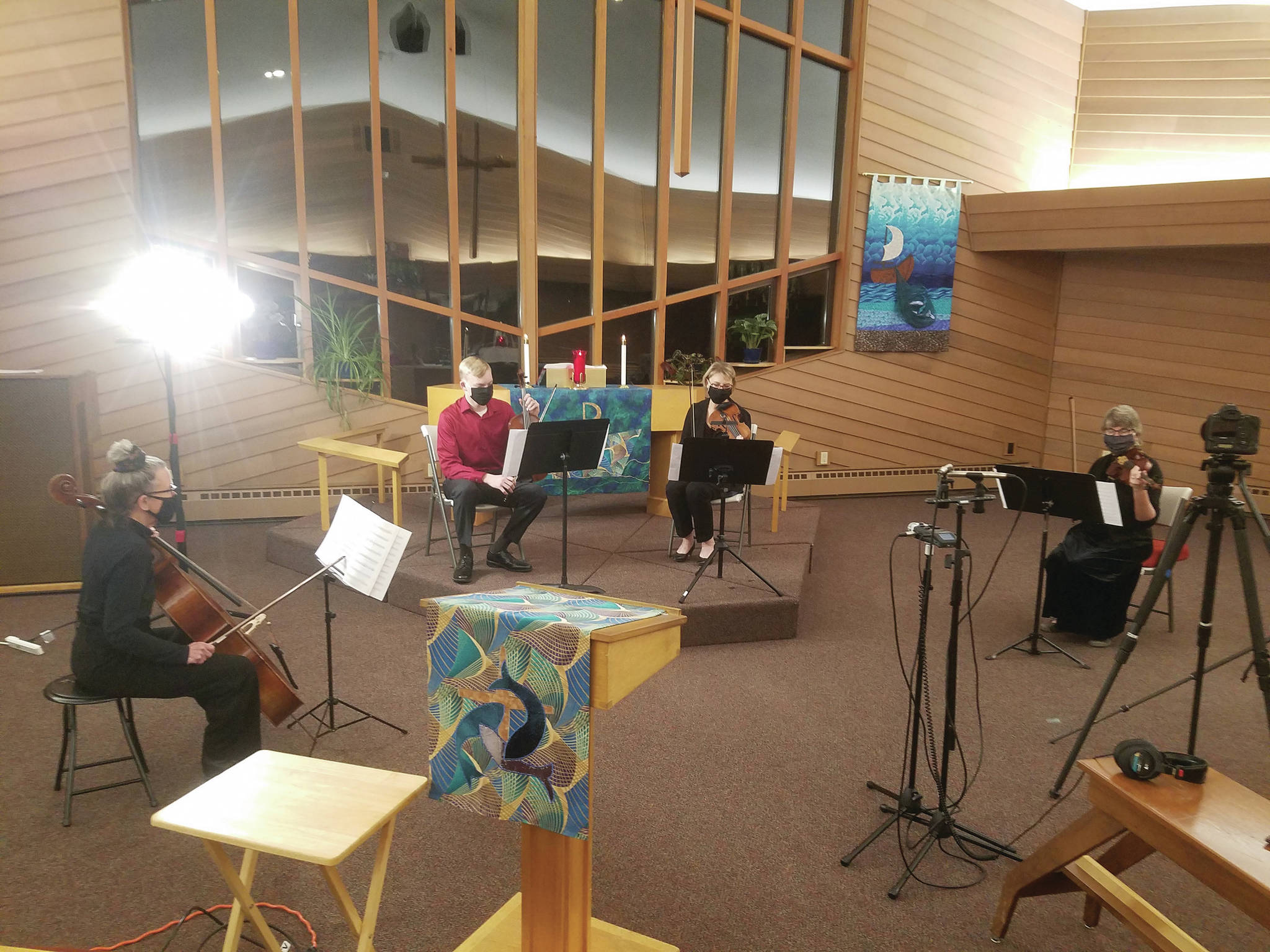 The string quartet of the Kenai Peninsula Orchestra plays for the film “Petite Nutcracker Ballet” on Nov. 18, 2020, at Soldotna Lutheran Church in Soldotna, Alaska. (Photo by Scott Bartlett)