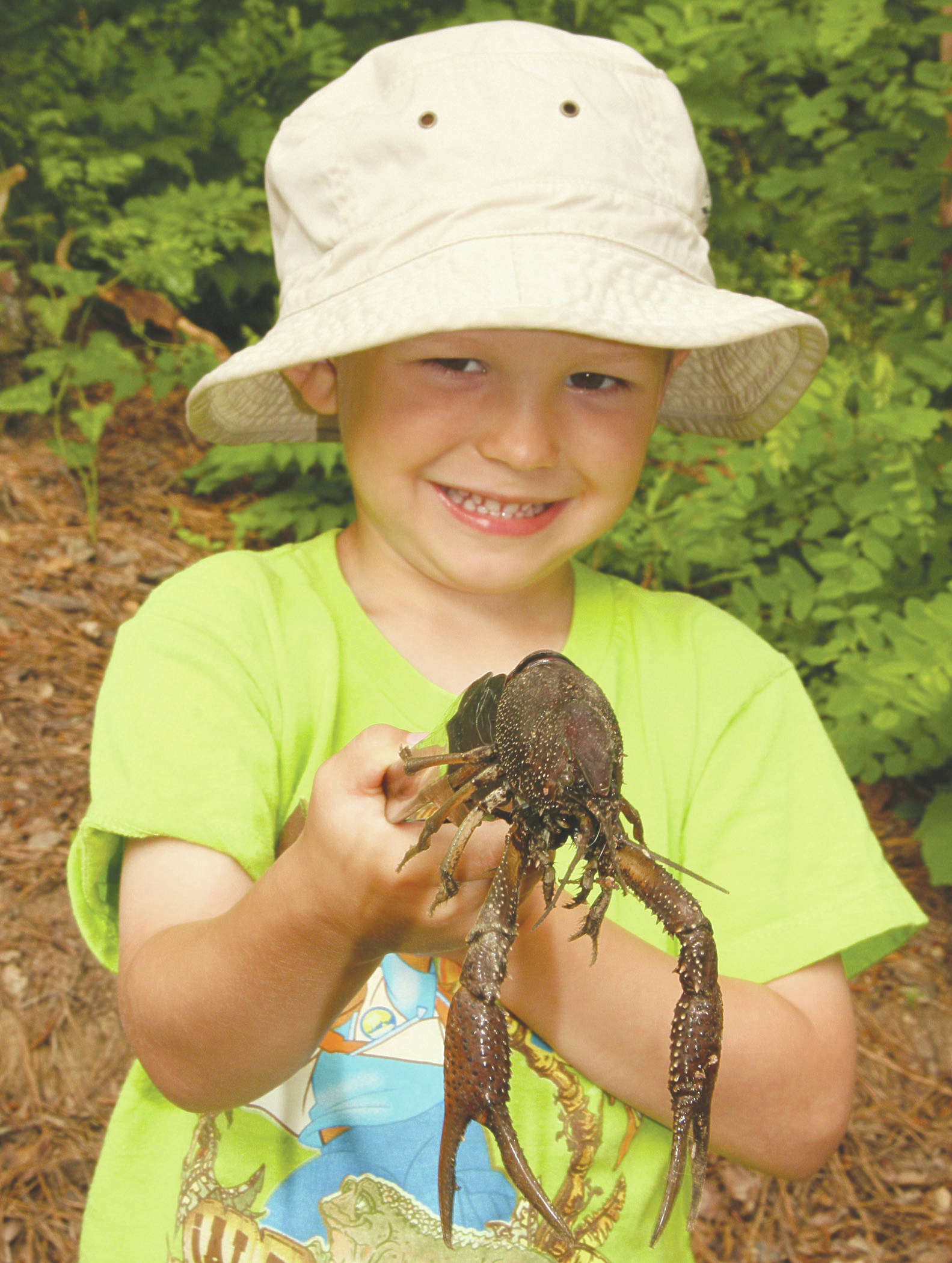 Wyatt, at age 4, helping dad harvest crawfish at White River NWR in Arkansas. (Photo by Matt Conner/USFWS)