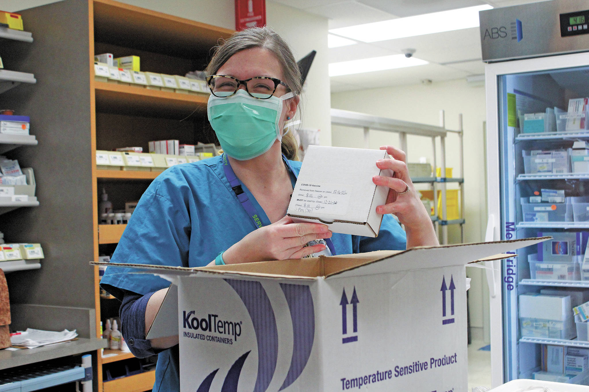 South Peninsula Pharmacist Jill Kort unpacks the Pfizer vaccine for COVID-19 shortly after it arrived at the hospital on Wednesday, Dec. 16, 2020 in Homer, Alaska. (Photo by Megan Pacer/Homer News)