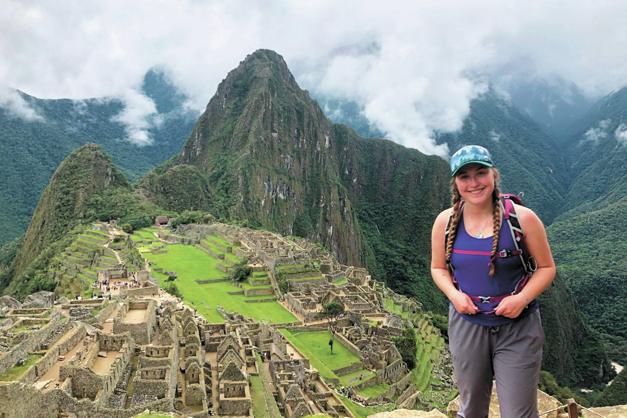 Brenna McCarron, a Homer High School graduate stuck in Peru after the country closed its borders to stem the spread of the novel coronavirus, stands at Machu Picchu, Peru. She was one of about 19 Alaskans stranded in the country at the time. (Photo courtesy Brenna McCarron)