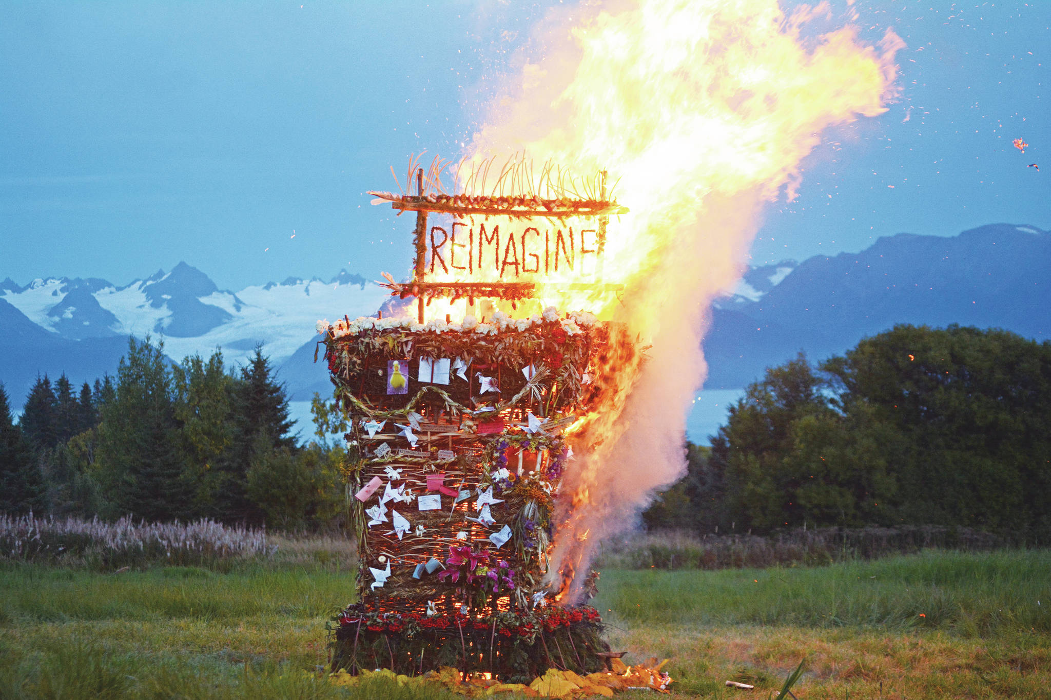 "Reimagine," the 17th annual Burning Basket, catches fire in a field on Sunday, Sept. 13, near Homer. Artist Mavis Muller intended to broadcast live on Facebook and YouTube the burning of the basket, but because of technical difficulties that didn't happen. (Photo by Michael Armstrong/Homer News)