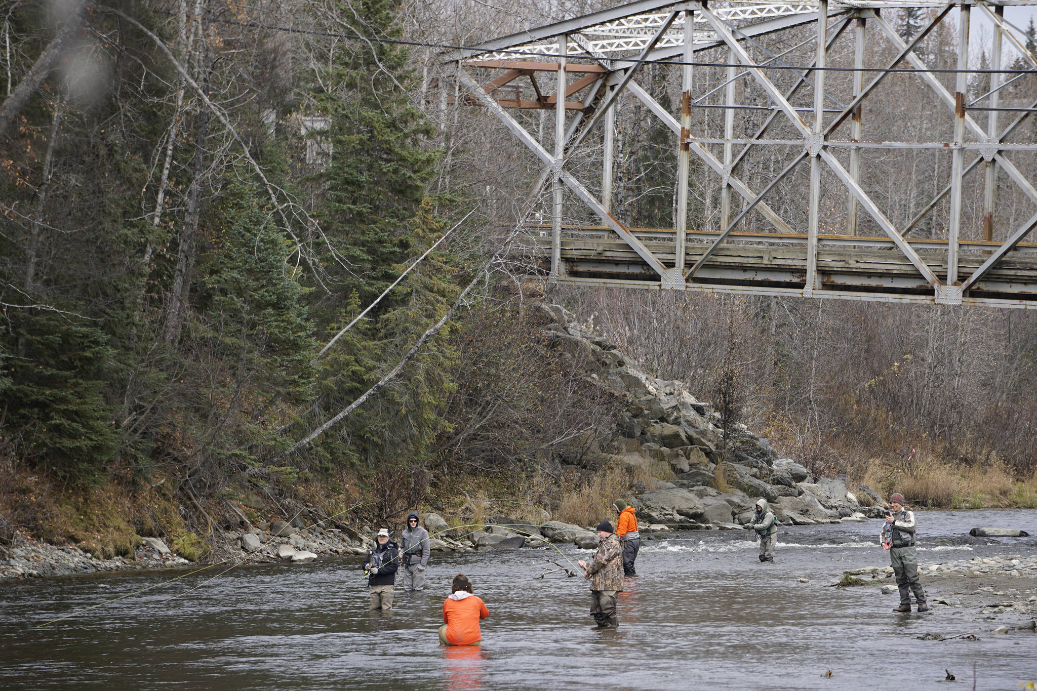 Anglers fish for steelhead in the Anchor River by the Anchor River Bridge on Saturday, Oct. 17, 2020, in Anchor Point, Alaska. (Photo by Michael Armstrong/Homer News)