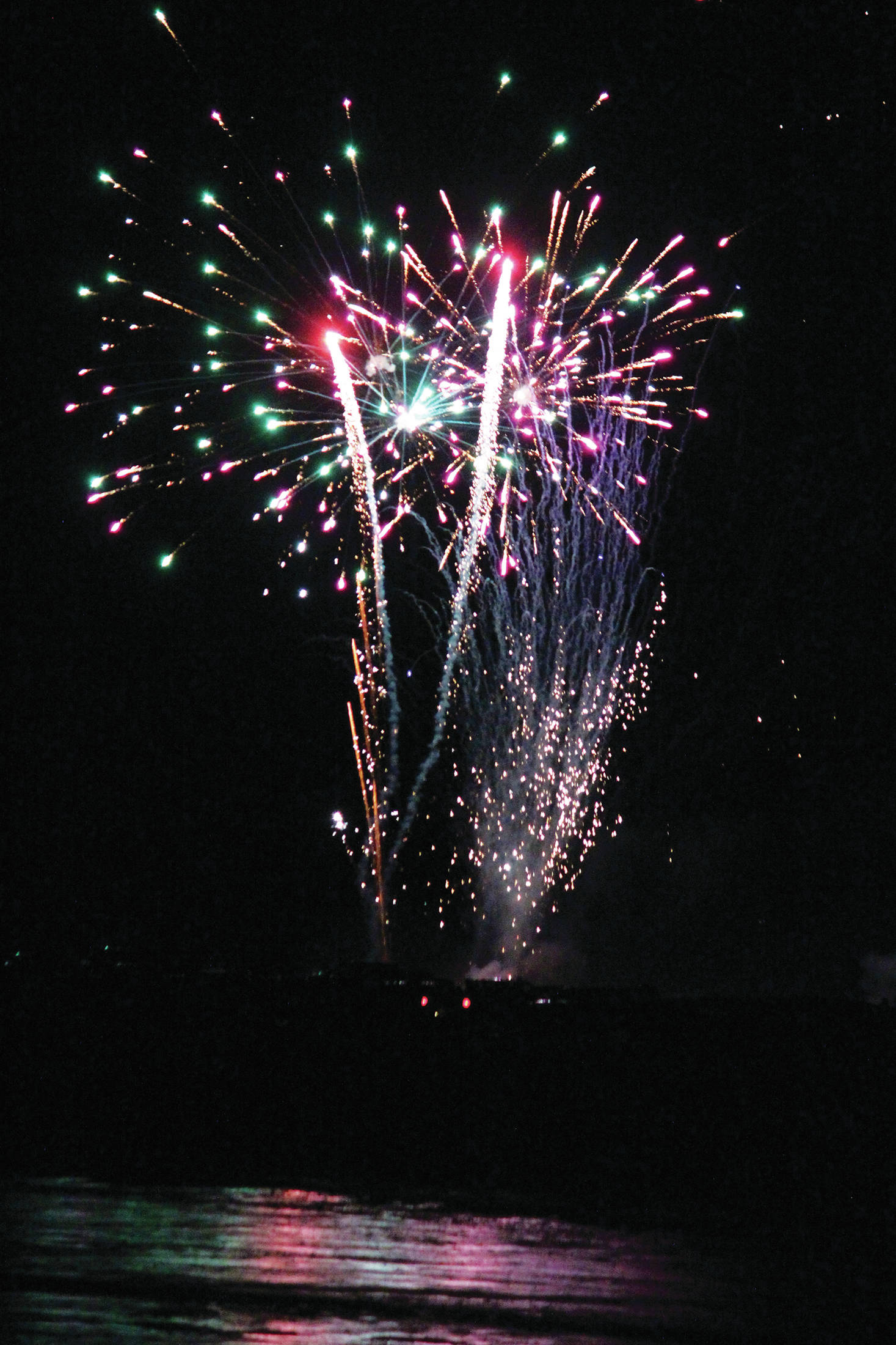 Fireworks explode above the Homer Spit on Dec. 31, 2020 as part of the third annual crowdfunded fireworks in Homer, Alaska. (Photo by Megan Pacer/Homer News)