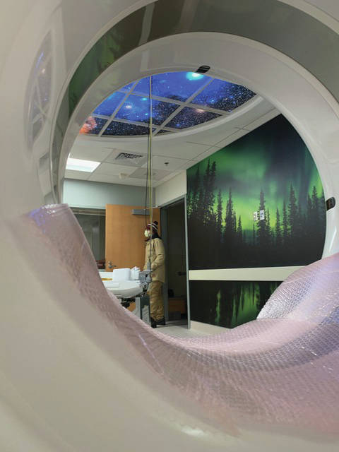 A wall mural of the northern lights and distraction lighting of a night sky are all part of the CT scanner suite renovation at South Peninsula Hospital, as seen here on Monday, Jan. 4, 2021, at South Peninsula Hospital in Homer, Alaska. The new scanner was moved into its new location on Monday. The mural and lighting are designed to contribute to a better patient experience. (Photo by Brent Lautenschlager / South Peninsula Hospital)