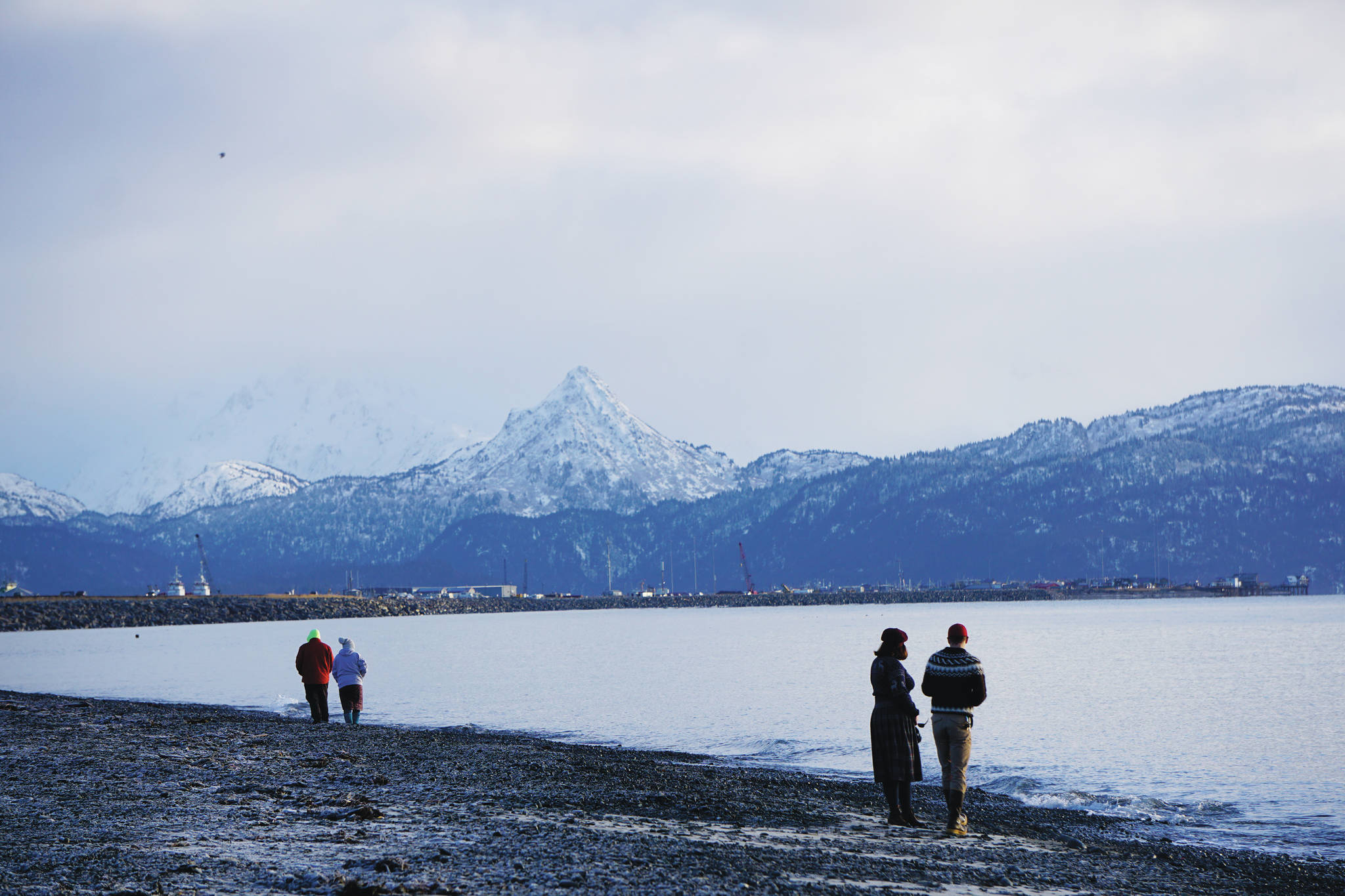 People walk the beach on the New Year’s Eve, Dec. 31, 2020, at Mariner Park on the Homer Spit in Homer, Alaska. (Photo by Michael Armstrong/Homer News)