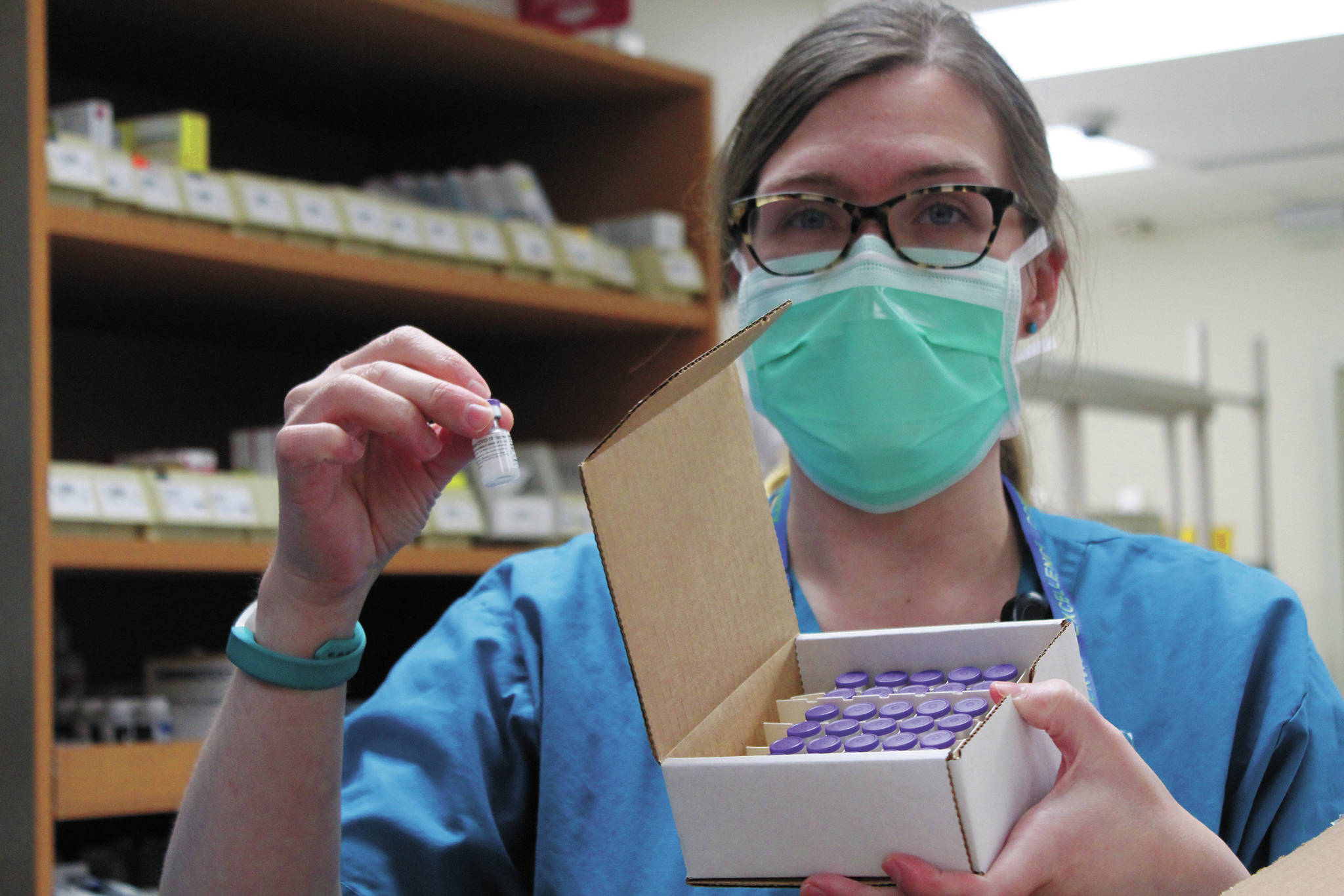 South Peninsula Pharmacist Jill Kort holds up a vial of the Pfizer vaccine for COVID-19 shortly after it arrived at the hospital on Wednesday, Dec. 16, 2020 in Homer, Alaska. (Photo by Megan Pacer/Homer News)