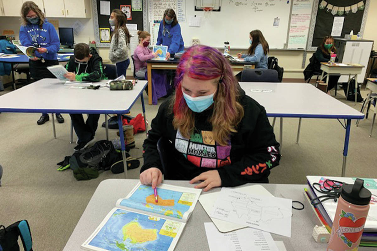 Student Lexie Alborn works on an assignment on Monday, Jan. 11, 2021 at West Homer Elementary School in Homer, Alaska. Students in elementary school were able to return to onsite education five days a week starting Monday. (Photo courtesy Joni Wise/West Homer Elementary School)