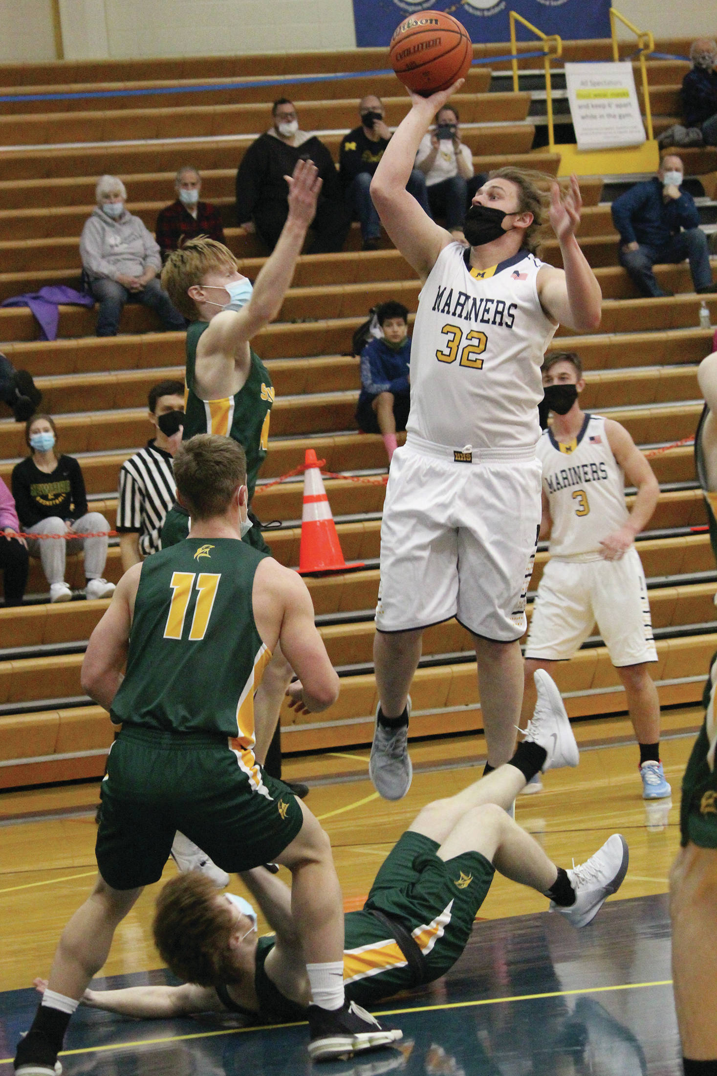 Homer’s River Mann goes up for a shot during a Saturday, Jan. 30, 2021 basketball game against Seward in the Alice Witte Gymnasium in Homer, Alaska. (Photo by Megan Pacer/Homer News)