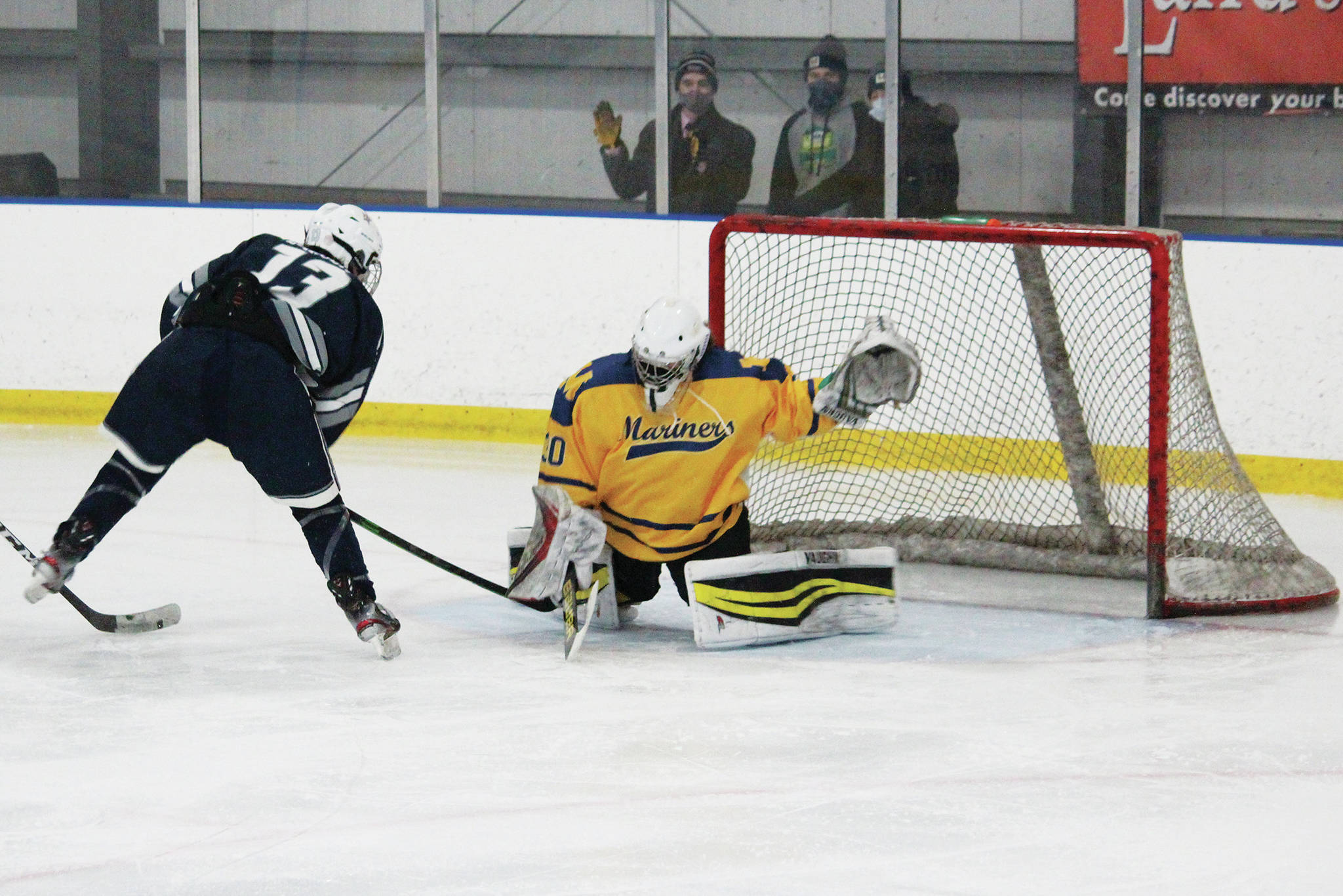 Freshman goaltender Blaise Banks stops a shot from Soldotna’s Silas Larsen during a Saturday, Feb. 6, 2021 hockey game at the Kevin Bell Arena in Homer, Alaska. (Photo by Megan Pacer/Homer News)