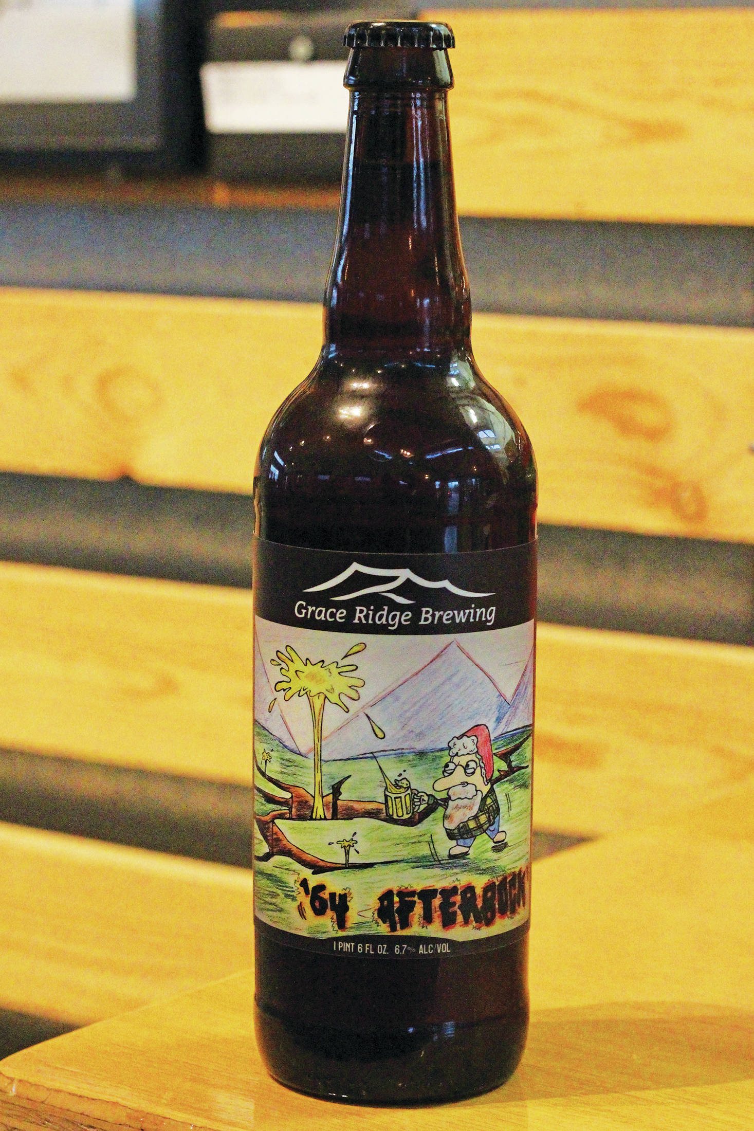The winning design of this year’s beer label contest for Kachemak Bay National Estuarine Research Reserve adorns a bottle of Grace Ridge Brewery’s ‘64 Afterbock on Friday, Feb. 5, 2021 at the brewery in Homer, Alaska. (Photo by Megan Pacer/Homer News)