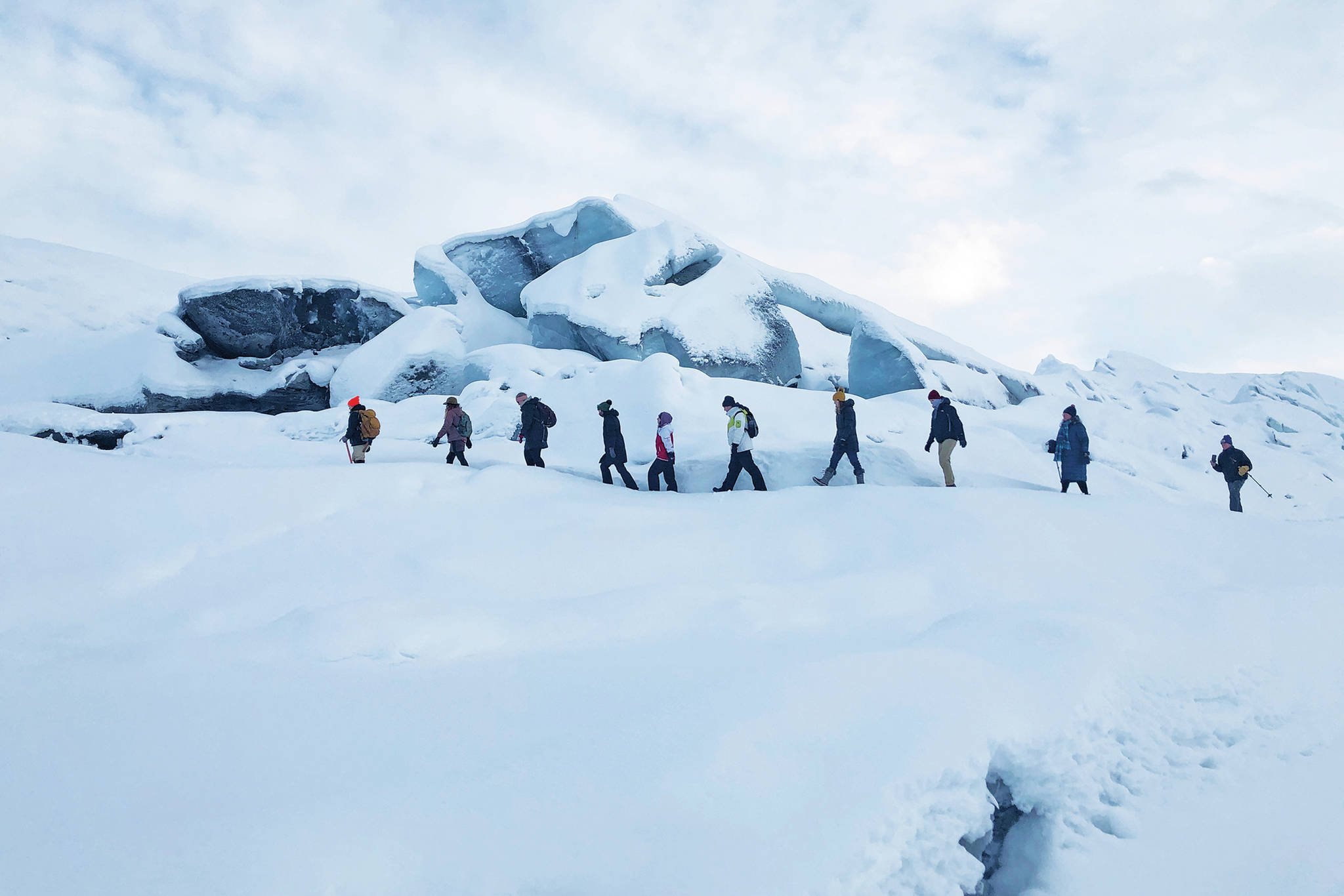 A group of explorers led by a guide tour the Matanuska Glacier on Jan. 17, 2021 in the Matanuska-Susitna Borough, Alaska. (Photo by Megan Pacer/Homer News)