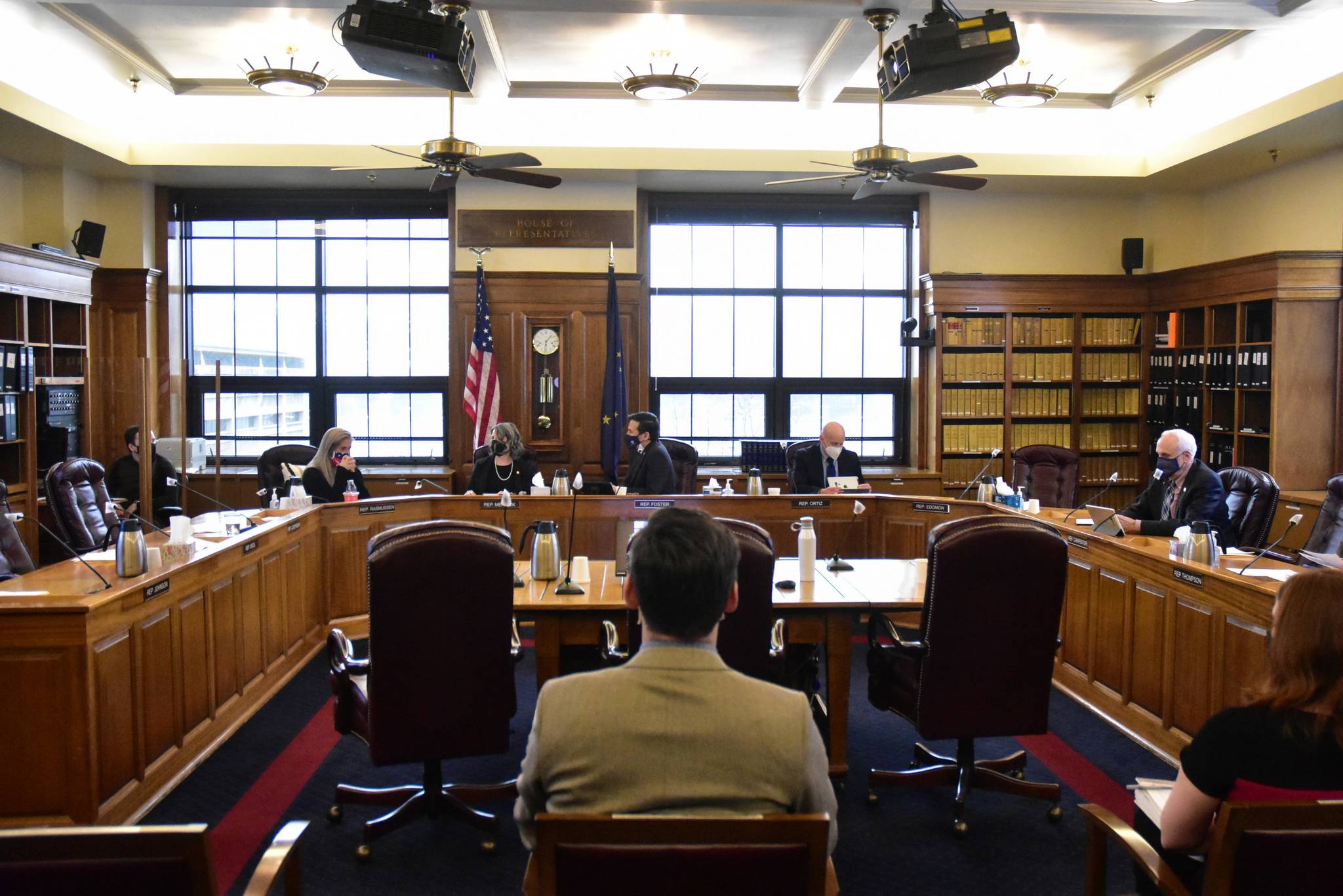 Members of the Alaska House of Representatives gather for a Finance Committee meeting on Monday, March 1, 2021 even after a staff member had tested positive for COVID-19. Meetings were canceled last week after Rep. Mike Cronk, R-Tok, tested positive. (Peter Segall / Juneau Empire)