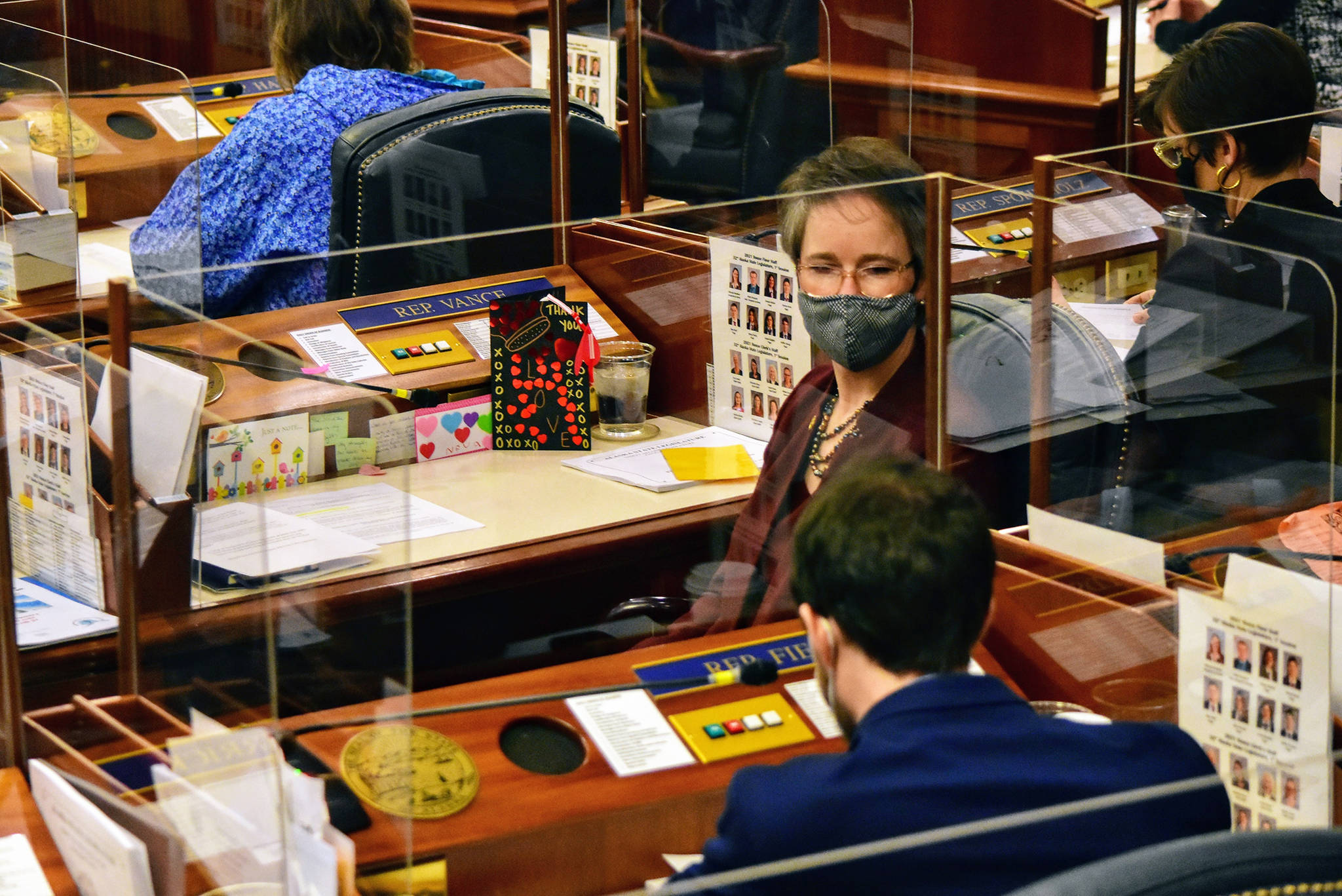Rep. Sarah Vance, R-Homer, listens as Rep. Zack Fields, D-Anchorage, delivers an apology on Friday, March 5, 2021, for earlier remarks. Vance called for a Sense of the House vote to rebuke Fields for his comments. (Peter Segall/The Juneau Empire via AP, Pool)