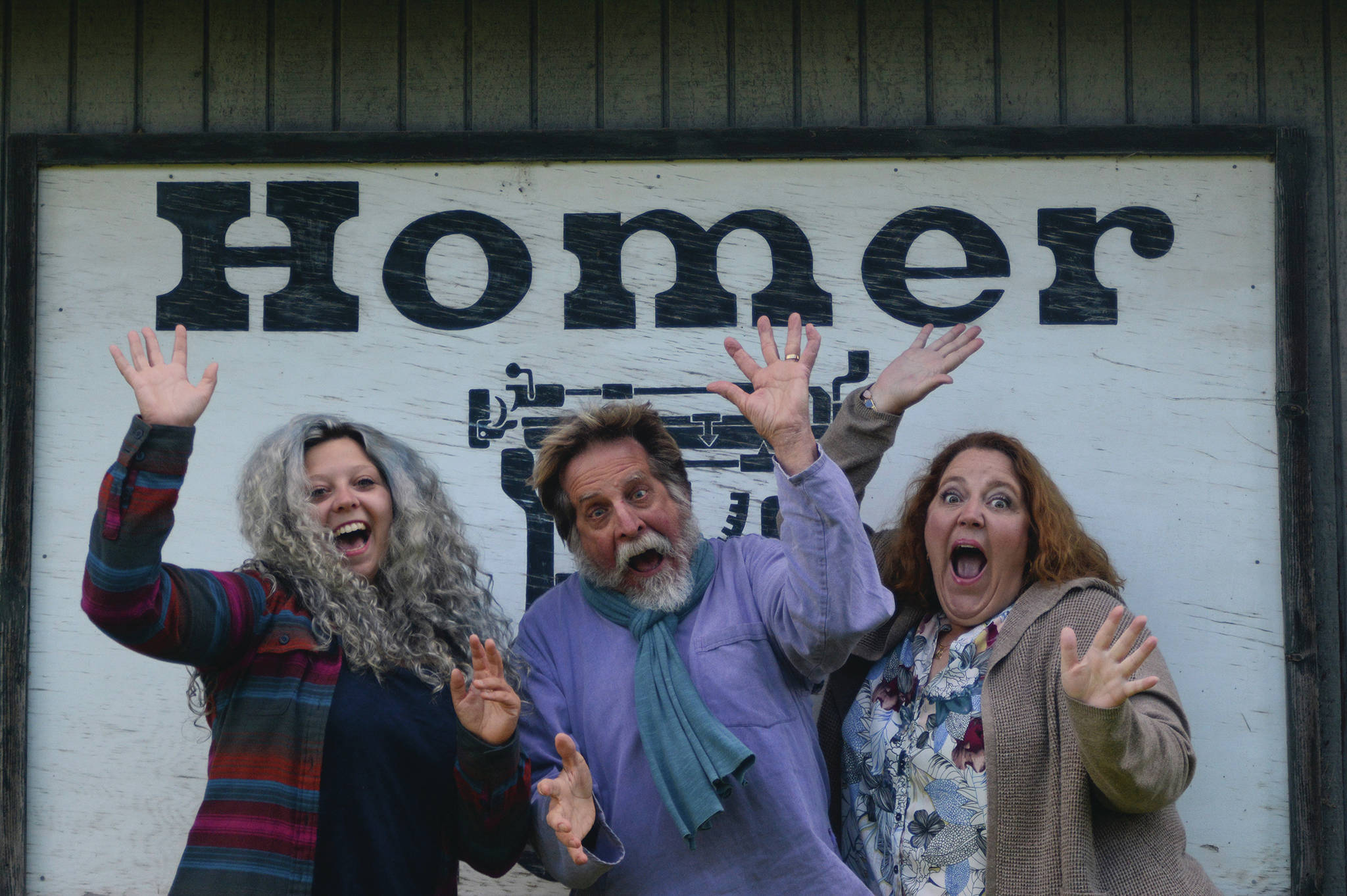 The author (left) enjoys taking a corporate photo with Editor Michael Armstrong (center) and advertising rep Malia Anderson (right) at the Homer News office in Homer, Alaska. (Photo by Michael Armstrong/Homer News)
