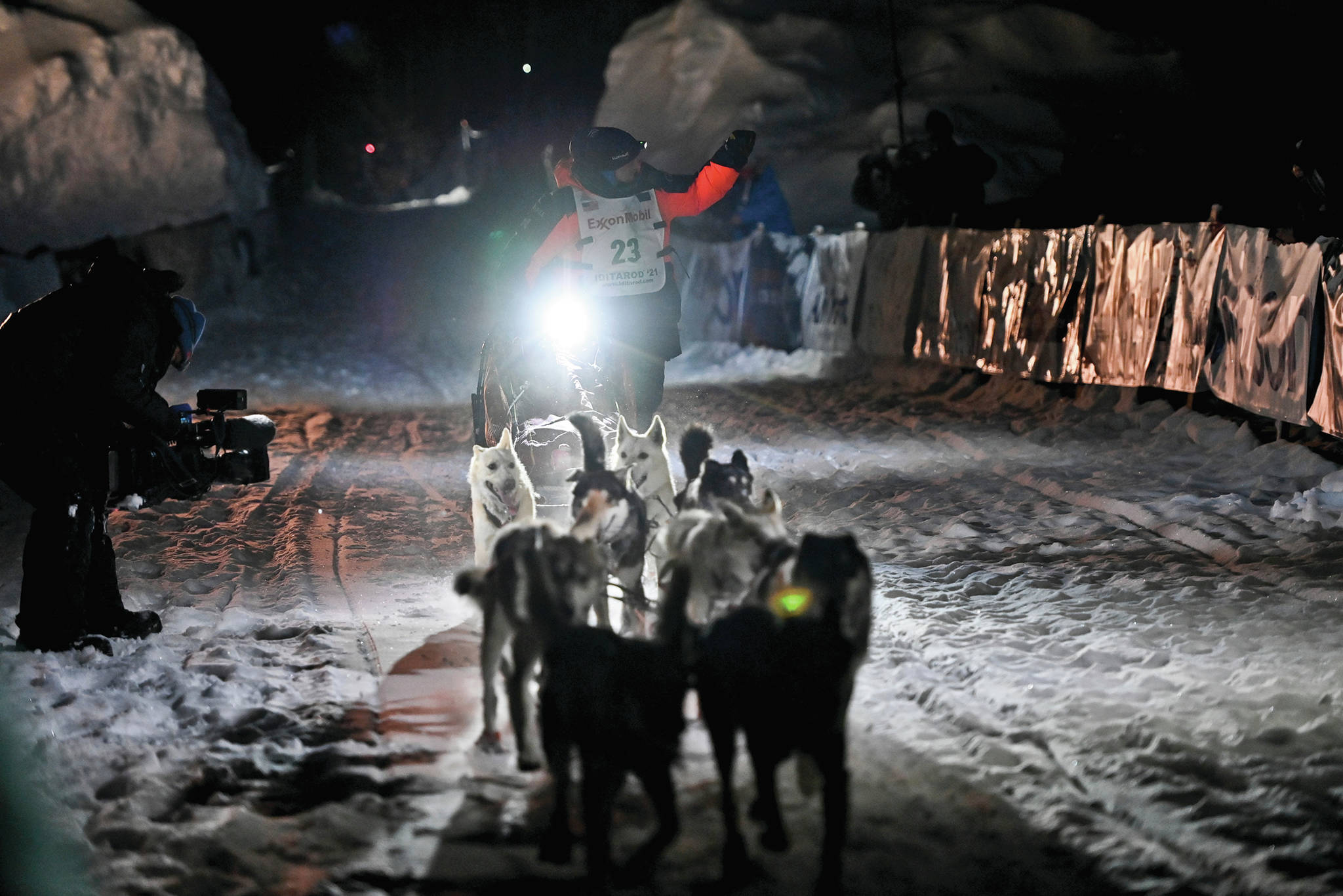 Dallas Seavey’s team runs into the chute near the finish line of the Iditarod Trail Sled Dog Race race near Willow, Alaska, early Monday, March 15, 2021. Seavey has won the Iditarod and matched a milestone in the world’s most famous sled dog race. It’s the fifth title for the 34-year-old Seavey, matching the record of most wins by any musher. (Marc Lester/Anchorage Daily News via AP)