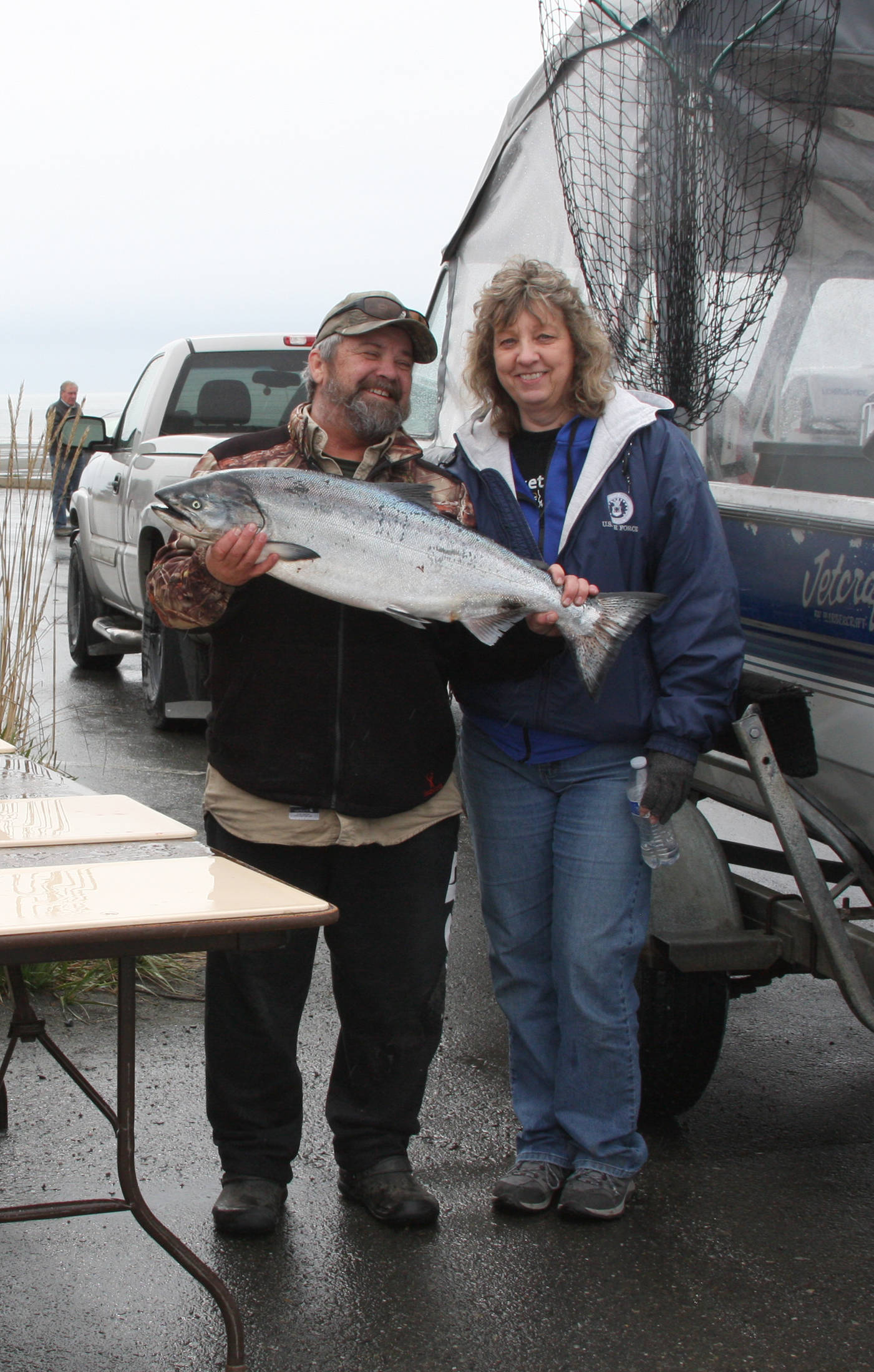 John and Yvonne Ketelle of Homer pose with one of the two king salmon caught on their boat, Circus Circus, at the weigh-in station during the Anchor Point Calcutta on Sunday, May 12, 2019 in Anchor Point, Alaska. (Photo by Delcenia Cosman)