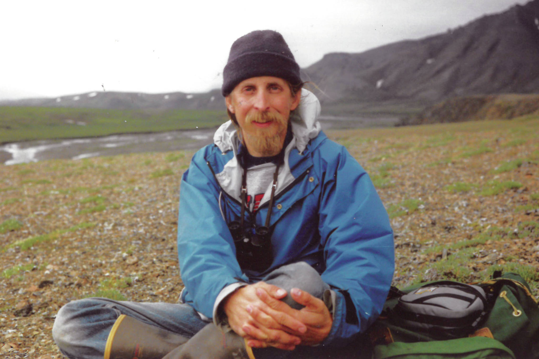Michael Armstrong is properly outfitted for an Arctic summer hiking trip in this photo taken in 1989 along the Wulik River in northeastern Alaska. (Photo by Charles Barnwell.)