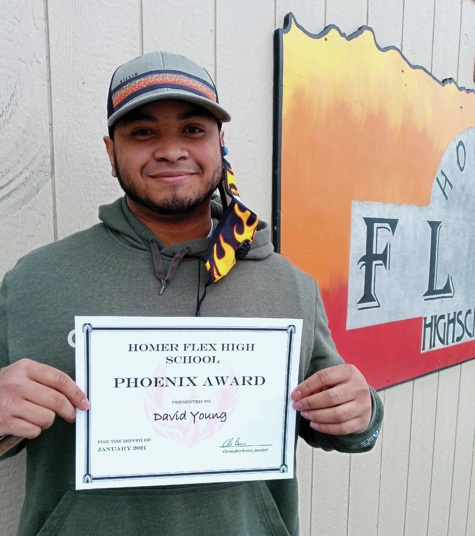 Homer Flex High School Phoenix Award winner David Young holds his certificate on March 25, 2021, at Flex High School in Homer, Alaska. (Photo courtesy of Homer Flex High School)